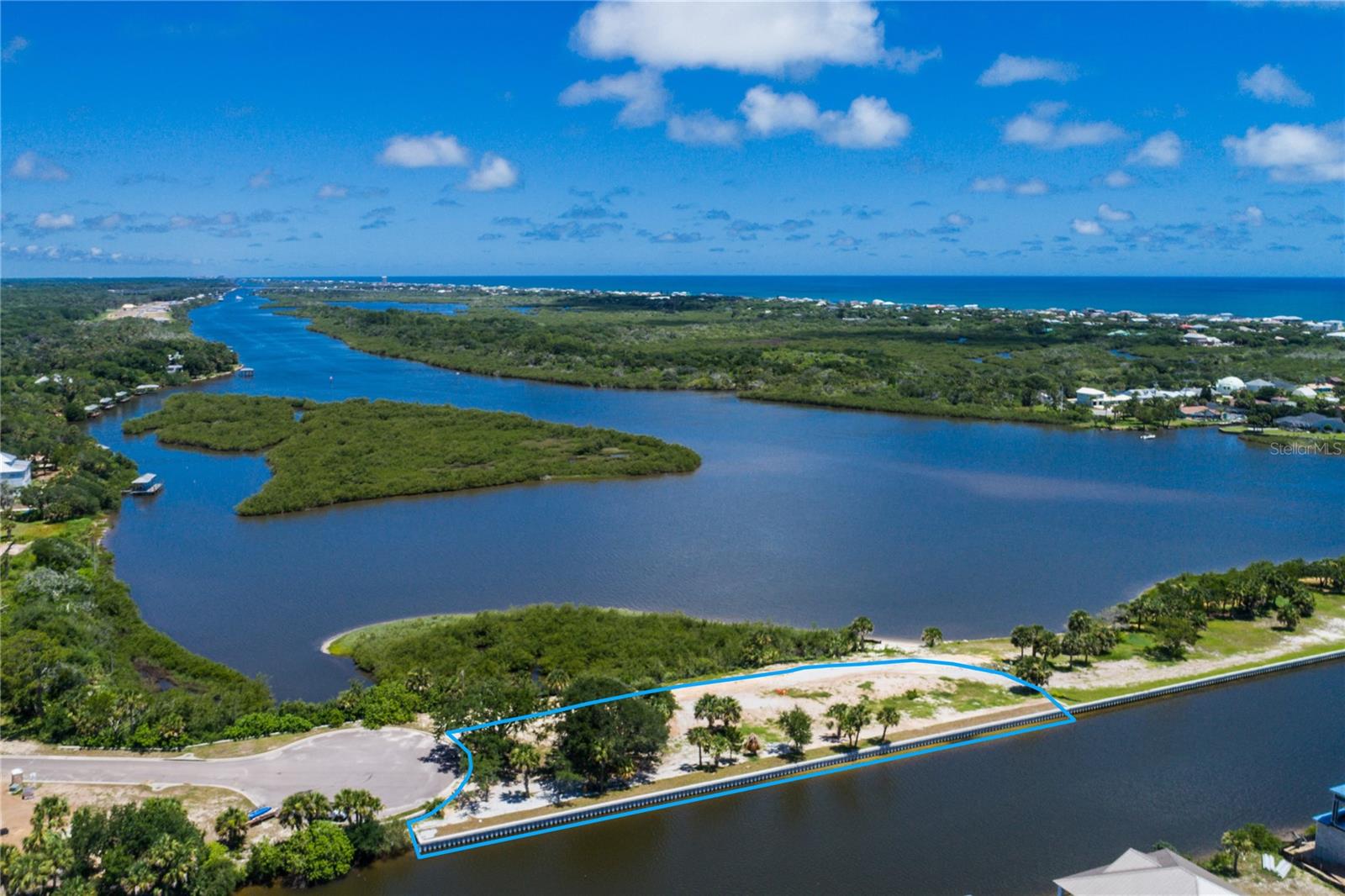 340’ WATERFRONT CANAL WITH AMAZING INTRACOASTAL VIEWS IN BEAUTIFUL SEASIDE LANDINGS GATED COMMUNITY – 1.2 acre homesite at the end of the cul-de-sac – brand new 340’ concrete seawall recently installed. Bring your boat and build your Dream Home on this 1+ acre unique homesite with Direct Access to the Intracoastal Waterway. Flagler Beach is just 5 minutes away!