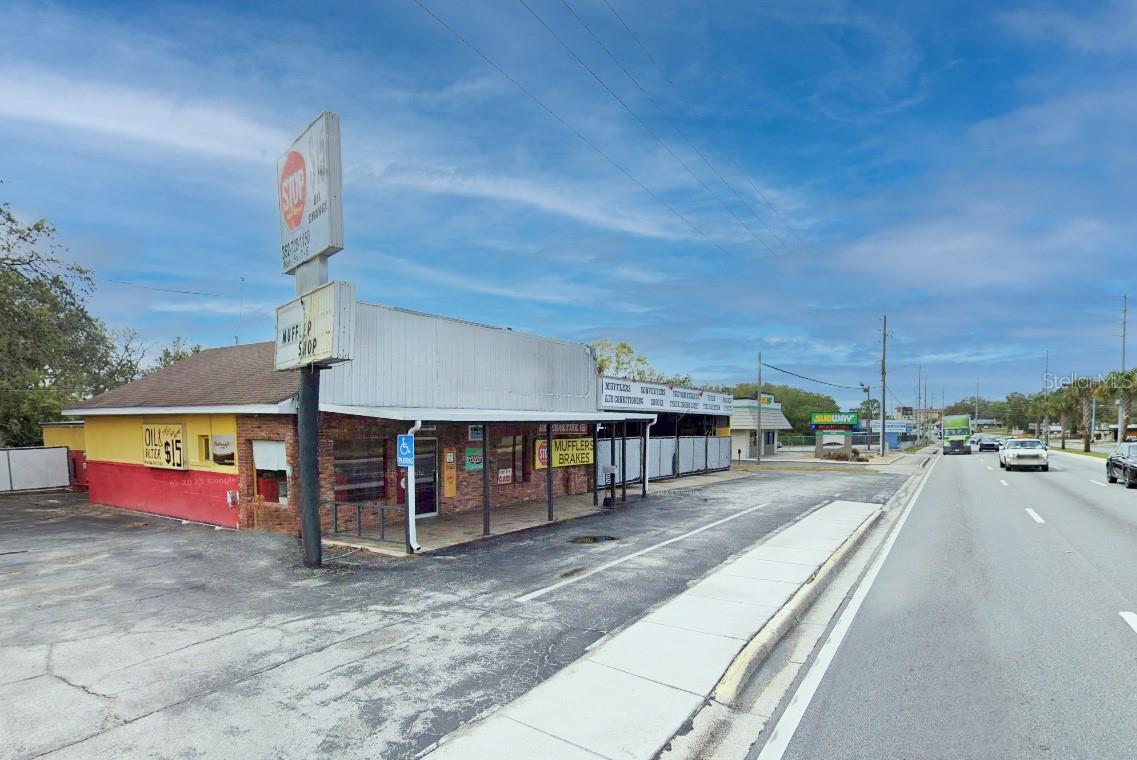 PRIME COMMERCIAL PROPERTY...located on US Hwy 441/27 between Subway and Domino's Pizza and across from Walgreens. Owner is currently operating 1st Stop Auto Repair from this location. Building features 5 automotive bays and 2 lifts, commercial counter and waiting area. Building also includes kitchen with living quarters, 2 bathrooms and 2 restrooms. Zoned Hwy Commercial. Property is FOR SALE!