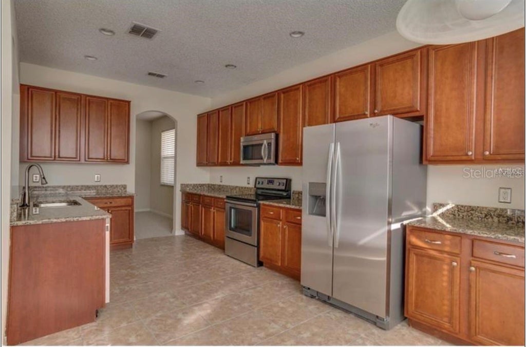 Photo of 10080 Savannah Bluff Lane, Orlando, FL 32829 (MLS # O6448662)