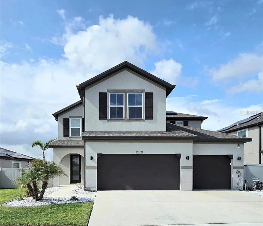 Welcome to resort-style living in the highly desirable Reserve at Pradera community! This beautifully maintained 5-bedroom, 3-bathroom Beazer Captiva model offers nearly 3,000 heated square feet and over 3,700 total square feet of thoughtfully designed living space. Only 3 years old, this home offers peace of mind with like-new major components including the roof, HVAC, plumbing, electrical, and water heater. Inside, you’ll find upgraded accent walls and a gourmet-style kitchen featuring quartz countertops, built-in features, abundant cabinetry, and an open layout perfect for entertaining. The oversized 638-square-foot 3-car garage is a standout feature, complete with a separate third-car stall equipped with its own mini-split A/C, epoxy floors, five heavy-duty ceiling storage racks rated for over 600 pounds each, and an included electric vehicle charging station. Step outside to enjoy the fully fenced backyard overlooking a peaceful pond, screened and covered lanai, and dedicated dog run — perfect for relaxing or entertaining. One thing we can't forget to mention is the solar panels, and with an acceptable offer they will be paid off at closing. This incredible community with an HOA under $200 yearly, allows residents to enjoy a resort-style pool, splash pad, dog park, basketball courts, scenic trails, and sidewalks throughout the neighborhood This move-in-ready home combines modern upgrades, functional space, and exceptional community living all in one.