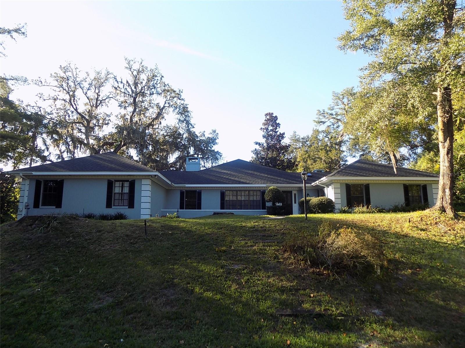 Lovely home nestled in a parklike setting. Located in the Dogwood Mountain Neighborhood minutes from historic downtown Mount Dora. Newer kitchen appliances. 3 bedroom 2.5 bath, 2 fireplaces, oversized rooms, private patios, family room and bonus room. 3 car garage
