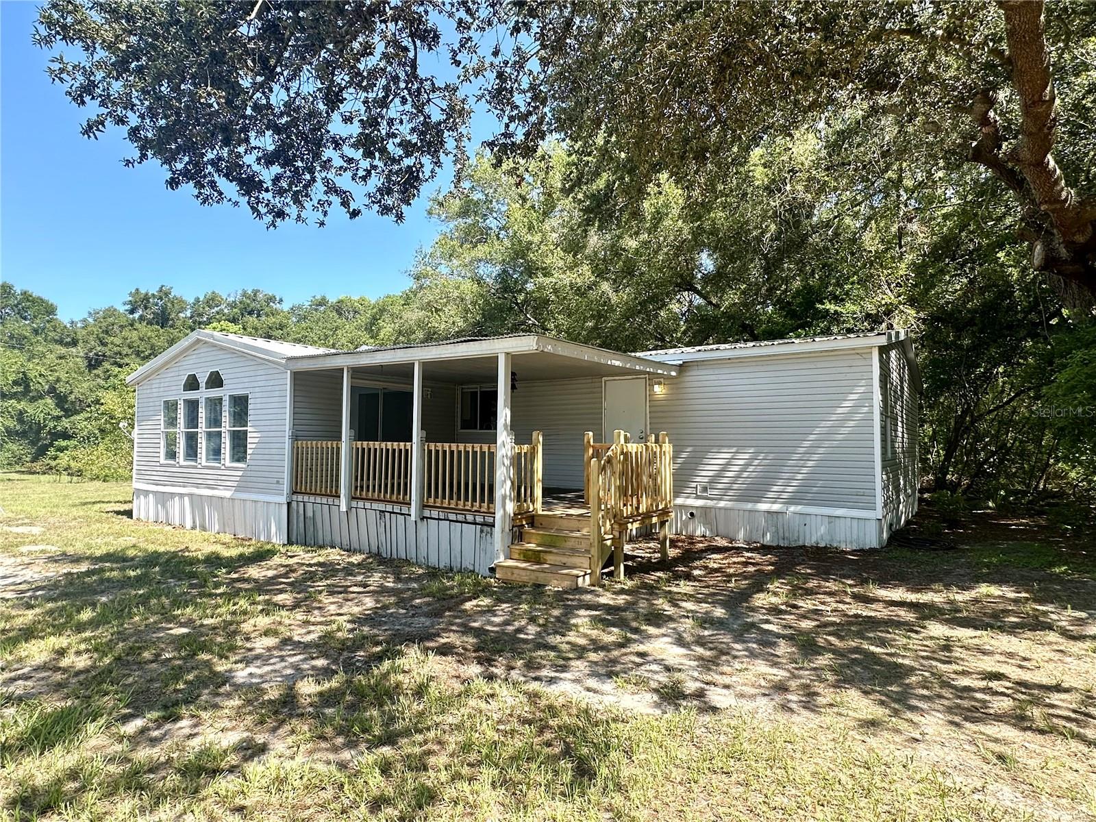 One or more photo(s) has been virtually staged. Looking for space, privacy, and comfort? This 3-bedroom, 2-bath manufactured home at 5450 Cemetery Rd, Mount Dora, FL is now available for lease — offering the perfect mix of rural charm and modern convenience on a fully fenced 1-acre lot.
Inside, you'll find a bright and functional layout with three generously sized bedrooms, two full bathrooms, and a welcoming living area that flows into the kitchen and dining space. Whether you're relaxing after a long day or hosting guests, this home provides the comfort and versatility you need.
The lease includes everything within the fenced 1-acre area, located immediately to the right after turning off the main shared easement. It’s your own private space to enjoy, perfect for gardening, pets, or outdoor living.
Need extra storage? A 12x24 shed is included with the rental—ideal for tools, equipment, or creating your own workshop or hobby space.
Tucked away in a quiet area, yet just minutes from downtown Mount Dora’s shops, restaurants, and events, this rental offers the best of both worlds. If you're ready to lease a home with room to breathe and space to grow, this is the one.
Spacious, private, and move-in ready — message us today to apply and book your tour!
This property offers an option of a security deposit-free lease using Obligos billing authorization technology for qualified tenants.
All Cani Property Management residents are enrolled in the Resident Benefits Package (RBP) for $59.00/month which includes liability insurance, credit building to help boost the resident's credit score with timely rent payments, up to $1M Identity Theft Protection, move-in concierge service making utility connection and home service setup a breeze during your move-in, our best-in-class resident rewards program, on-demand pest control, HVAC filters, and much more! More details upon application.
Non-refundable application fee of $75 per person above the age of 18 years of age. One time admin fee of $295 for approved application.