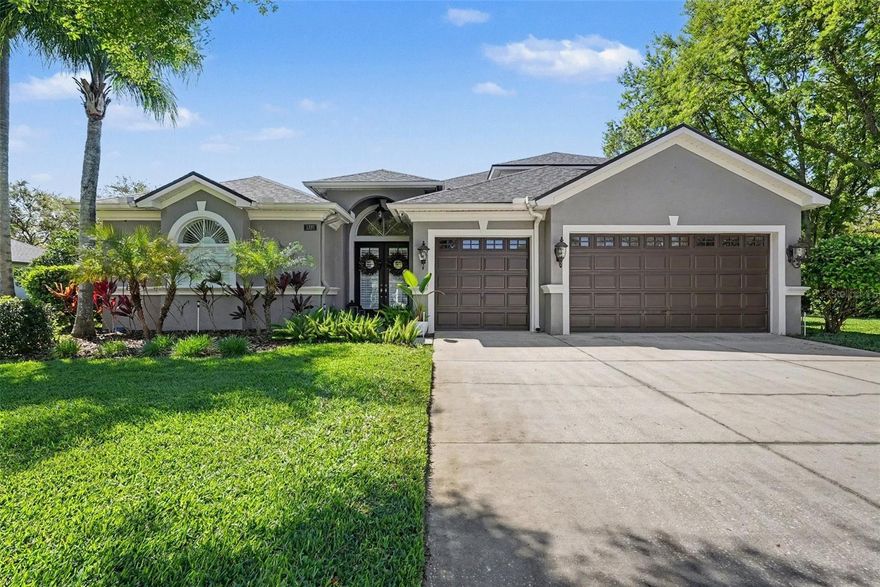 Boating, tubing, and sunset dock nights—this is a home that delivers more than just square footage. Lakes of Wellington welcomes you with its exclusive, quiet Southern charm. Residents of this gated enclave of just 60 homes enjoy a private park shaded by mature greenery, along with tennis and basketball courts, a playground, and access to ski-sized Hog Island Lake with a private boat ramp and dock. Enter through its brick walls and iron gates, where magnolia trees shade your arrival and porches, patios, and fountain ponds invite evening strolls and neighborly connection. Set on a quiet cul-de-sac and situated on over half an acre, this beautifully updated 4-bedroom, 3-bath home offers more than 3,400 square feet of flexible living space and a rare combination of privacy, function, and move-in-ready condition. Inside, the home has been extensively refreshed with luxury vinyl plank flooring throughout, interior paint including cabinetry, and updated bathrooms with new tile and fixtures. Major system updates—including a newer roof, HVAC systems, and pool improvements—provide peace of mind and eliminate the need for costly projects. The floor plan offers both openness and flexibility, with a first-floor primary suite, multiple living areas, and a private guest/in-law suite with its own bathroom and separate exterior entrance—ideal for multigenerational living, guests, or a private workspace.
The kitchen opens seamlessly to the main living areas, creating a natural gathering space for everyday living and entertaining. Step outside to your private backyard retreat, where a saltwater pool, screened enclosure, and updated pool deck create the perfect setting for relaxing or hosting. The expansive homesite offers space to spread out, entertain, and enjoy the Florida lifestyle year-round. With no CDD fees, flood insurance not required, and a community that blends peaceful surroundings with convenient access to major roadways, shopping, dining, and top-rated schools, this home offers both lifestyle and practicality. If you’ve been waiting for a move-in ready home with space, updates, and true lifestyle value, this is one worth seeing in person.