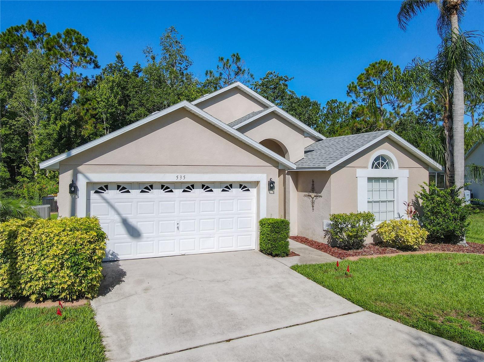 Nestled at the edge of a tranquil wooded preserve, this beautifully updated 4-bedroom, 2-bathroom pool home offers the privacy, comfort, and versatility you’ve been looking for. Whether you're searching for a permanent residence, vacation retreat, or income-generating rental, this property checks all the boxes.Step inside to a bright, open layout with tile flooring throughout the main living areas and cozy carpeted bedrooms. The formal dining room is framed by elegant interior columns, adding a touch of sophistication to your gatherings. The heart of the home—the kitchen—has been upgraded with granite countertops and stainless steel appliances, offering both style and functionality with breakfast bar and dinette. The spacious primary suite features sliding glass doors that open directly to the pool deck, creating a true indoor-outdoor lifestyle. The en-suite bathroom is a spa-like escape with dual sinks, a soaking tub, and a separate shower. Plus, an owner's lock-up closet adds security for those using the home as a rental. Outdoors, enjoy the private, heated pool surrounded by peaceful wooded views and no rear neighbors. The covered lanai is perfect for al-fresco dining or lounging in the shade. And for extra fun, the garage has been converted into a game room complete with a pool table—a guest favorite! New Roof (2023), new AC Unit (2019), new pool pump (2022). Whether you're soaking up the sun, hosting family and friends, or enjoying the income from short-term rentals, this home delivers on every front. Don’t miss your chance to own this slice of Central Florida paradise—schedule your private showing today!