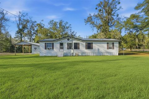 Photo of 144 NE 159th Avenue, Old Town, FL 32680 (MLS # W7883585)