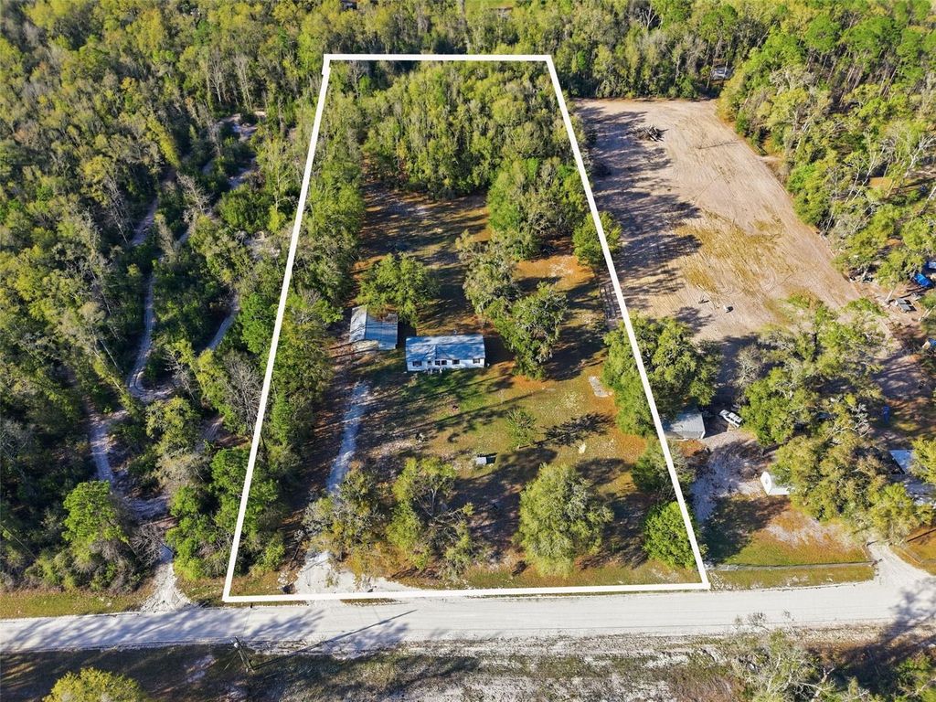 Photo of 144 NE 159th Avenue, Old Town, FL 32680 (MLS # W7883585)