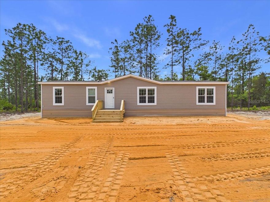 BRAND NEW! This nearly 1,600sqft manufactured home is ready for you to move right in. Featuring many upgrades including a coffee bar, a soaking tub and separate walk in shower in the master, dedicated laundry room with a folding shelf and sink, mudroom, spacious back porch, metal skirting, a crushed concrete circle drive, no carpet and more. The kitchen has beautiful two toned cabinetry with an oversized island, deep farmhouse sink and upgraded stainless appliances. This tastefully designed home has all of the modern touches that most desire including the wooden beams in the living area. Seller is offering $5,000 towards buyers closing costs! USDA eligible!