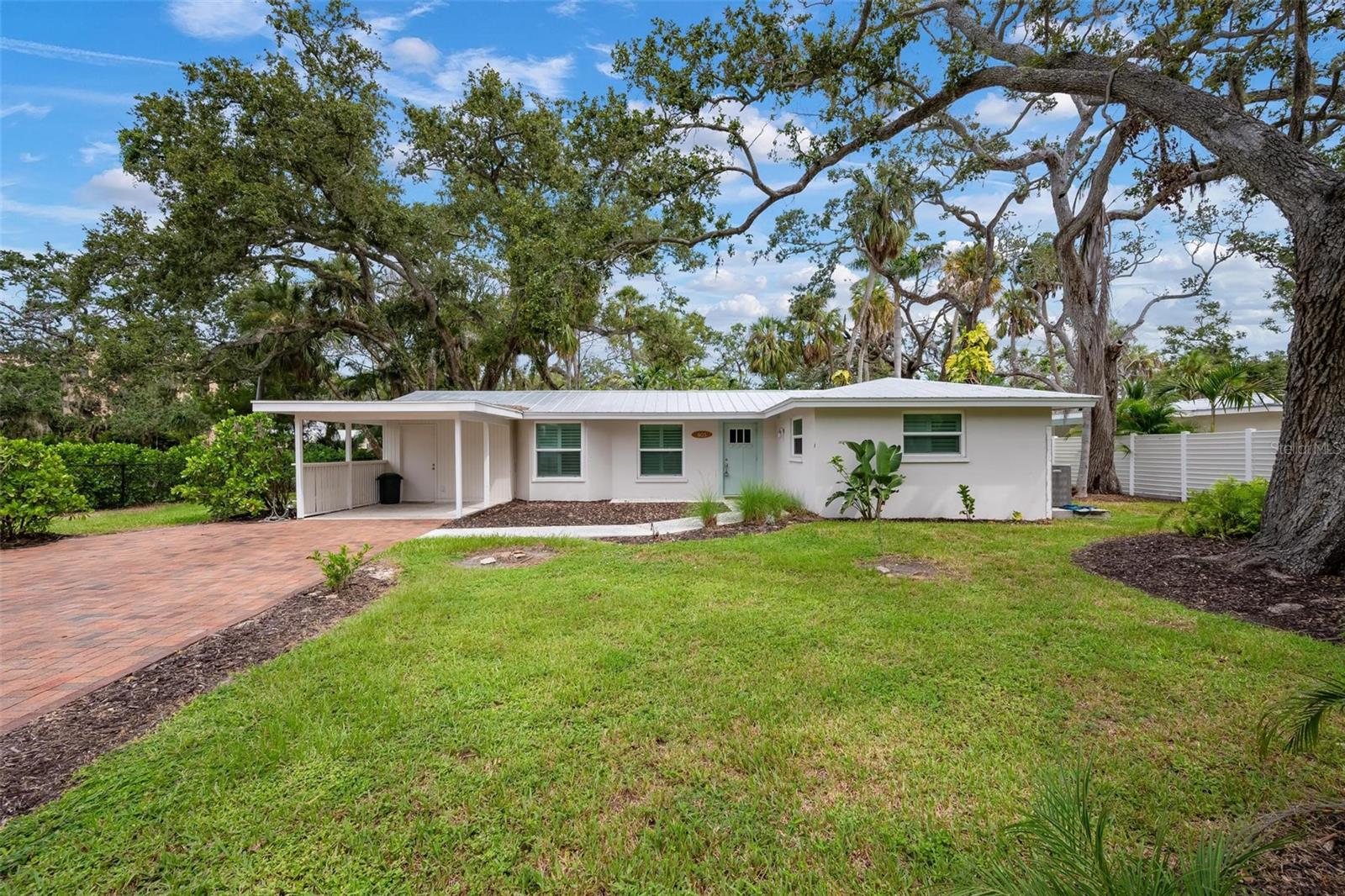 Welcome to this beautifully updated Indian Beach Sapphire Shores West of Trail residence situated on a gorgeous oversized corner lot with mature Florida trees and plants. It is nestled in a upscaled neighborhood with just steps to the Bay.  Offering 1,242 square feet of refined space, this 2-bedroom, 1-bath home features a spacious layout ideal for both everyday living and entertaining.  Modern kitchen features breakfast bar and dining area. Bright and sunny family room opens to the expansive back yard an ideal area to enjoy the outdoors in the Sunshine State. This home is minutes to Ringling Museum, Jungle Gardens, USF Sarasota, New College Sarasota, Ringling School of Arts, Van Wezel Performing Arts Hall, St Armands Circle With Lido Beach and Siesta Key Beaches. University Town Center Mall also just minutes away.  Call now to book!