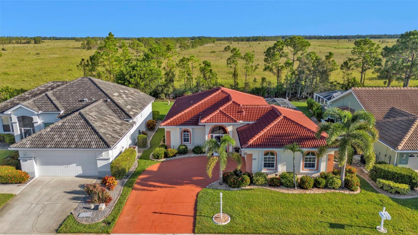 Welcome to 2831 Corinthia Cir, an IMMACULATE and SPACIOUS home located in the desired Heron’s Glen Golf and Country Club in North Fort Myers! This home is located near the end of a quiet cul-de-sac road, has a unique and desired side entrance garage, and has some of the most amazing views in Southwest Florida! The view from the backyard is nothing short of mesmerizing and can be best described as an UNBROKEN HORIZON OF GOLDEN GRASSLAND!
NOW OFFERING A $5,000 CLOSING COST CREDIT. This well-kept 1,665 square foot home features 2 bedrooms, 2 bathrooms, and a LARGE FAMILY ROOM which can be used as an additional bedroom, office, or whatever your creative mind allows! Once you enter the home through the front door you will immediately be presented with a spacious feel and PLENTY OF NATURAL LIGHT. You will find your guest and master suites on the left side of the home, living, family, and dining rooms in the middle, and kitchen to the right. Don’t forget to check out the INCLUDED FLOOR PLAN to get a great sense of this home’s convenient and flowing interior.
Some of the great updates in this near perfect home include a TILE ROOF 2019, PAINT 2021, WATER HEATER 2022, HURRICANE IMPACT WINDOWS, & EPOXY COVERED GARAGE FLOOR! You will also find a RENOVATED KITCHEN with wood cabinets, granite counters, stainless appliances, and sliding doors leading to the screened-in lanai which overlooks the pastureland where you can sit and peacefully watch for wildlife, enjoying the tranquil sounds from your own backyard.
Heron’s Glen is a wonderful, gated golf course community with a newly renovated lobby and clubhouse, full of activities including a new fitness center, bocce courts, pickleball and tennis courts, and tons of other amenities for your enjoyment. Conveniently located in North Fort Myers, you are close to several airports, and all the shops, dining, and entertainment you can imagine! Call your favorite real estate agent today to see this amazing property in person! WELCOME TO PARADISE, WELCOME HOME!!