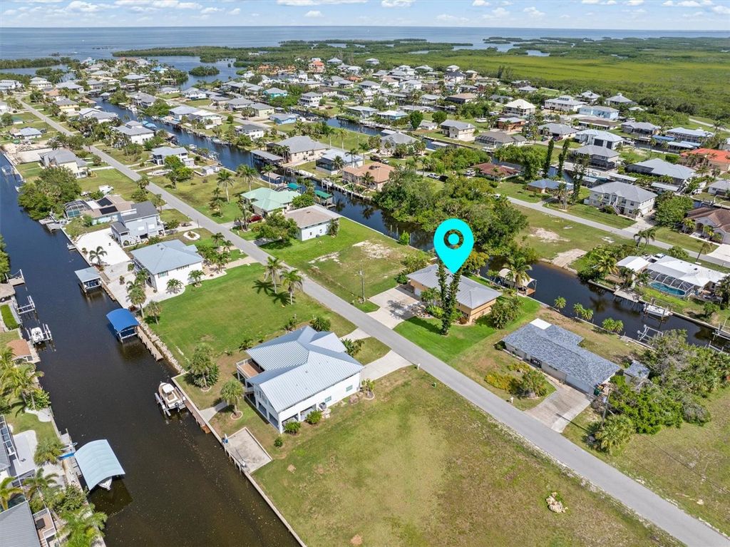 Photo of 24398 Treasure Island Boulevard, Punta Gorda, FL 33955 (MLS # C7510960)