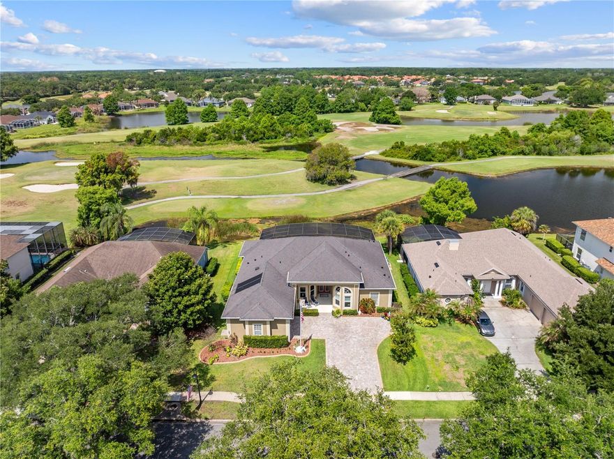 STUNNING UPDATED POOL HOME IN KISSIMMEE BAY GOLF COMMUNITY! Exceptional INDOOR/OUTDOOR LIVING with TWO SETS OF EXTRA-LARGE SLIDERS opening to the SALTWATER POOL & SPA! Enjoy breathtaking SUNSET VIEWS overlooking the 15th hole, creating the perfect backdrop for relaxing evenings.

Prepare to be impressed by this beautifully upgraded 3-bedroom + office, 2 full bath and 2 half bath home offering 2,834 heated square feet and nearly 4,000 total square feet of exceptional living space. Located in the highly desirable Kissimmee Bay golf community, this home combines luxury updates, spacious living, and incredible entertaining.

From the moment you arrive, the NEW PAVER DRIVEWAY (2024), UPDATED LANDSCAPING (2023), fresh EXTERIOR PAINT (2022), and elegant GLASS FRONT DOOR INLAYS (2024) create beautiful curb appeal. Step inside to discover UPDATED WOOD FLOORING (2022-2023), TRAVERTINE FLOORS in the entry, living room, dining room, and kitchen (2023), fresh INTERIOR PAINT (2026), and custom upgrades throughout.

The UPDATED KITCHEN (2023) features GRANITE COUNTERTOPS, WOOD CABINETRY, GE convection oven, ZLINE convection microwave and range top, BOSCH dishwasher, updated sink and aerator, under-sink filtration system, and refrigerator replaced in 2021. Washer and dryer are included.

The spacious family room showcases a CUSTOM ENTERTAINMENT CENTER with MAPLE CABINETRY and GRANITE COUNTERTOPS added in 2024. A beautiful Venetian dining room light fixture added in 2024.

Step outside to your PRIVATE BACKYARD OASIS featuring a FULLY UPDATED SALTWATER POOL. Major pool upgrades completed in 2022 include pool resurfacing, new pool equipment, gas heater, heat pump, and automated pool control system. The outdoor living space is perfect for entertaining with a spectacular OUTDOOR KITCHEN added in 2024 featuring a sink, griddle, and leather-finish quartzite countertops plus REAR AWNING (2023), updated lanai fans (2023), new lanai screens (2022), and OUTDOOR TV (2024).

Additional major updates include:
• A/C replaced in 2022
• Roof replaced in 2016 with Presidential shingles
• Central vacuum system installed in 2023
• 200-amp electrical service
• Generator outlet with exterior pad
• Oversized 589 sq ft garage.

This meticulously maintained home offers the perfect blend of comfort, style, and functionality in one of Central Florida’s most sought-after golf communities. Discover Kissimmee Bay – A True Hidden Gem Kissimmee Bay offers an exceptional lifestyle with built-in value and a strong sense of community. Residents enjoy complimentary irrigation water to keep lawns lush year-round. HOA assessments include high-speed internet and cable TV. Outdoor enthusiasts will love the recreation opportunities. Just outside the community entrance, a scenic bike path stretches 12 miles round-trip toward St. Cloud. The community offers golf, tennis, basketball, and pickleball, plus an active social calendar. Residents also have access to on-site RV, boat, and jet ski storage (for a nominal annual fee), plus direct access to East Lake Tohopekaliga with a convenient boat launch. Neighbors enjoy regular social events including bi-weekly trivia nights and Friday par-three outings. Above all, Kissimmee Bay is known for its welcoming, friendly neighbors who enjoy walking the community and celebrating events together. It’s where lifestyle, value, and connection come together—a true hidden gem in Central Florida.