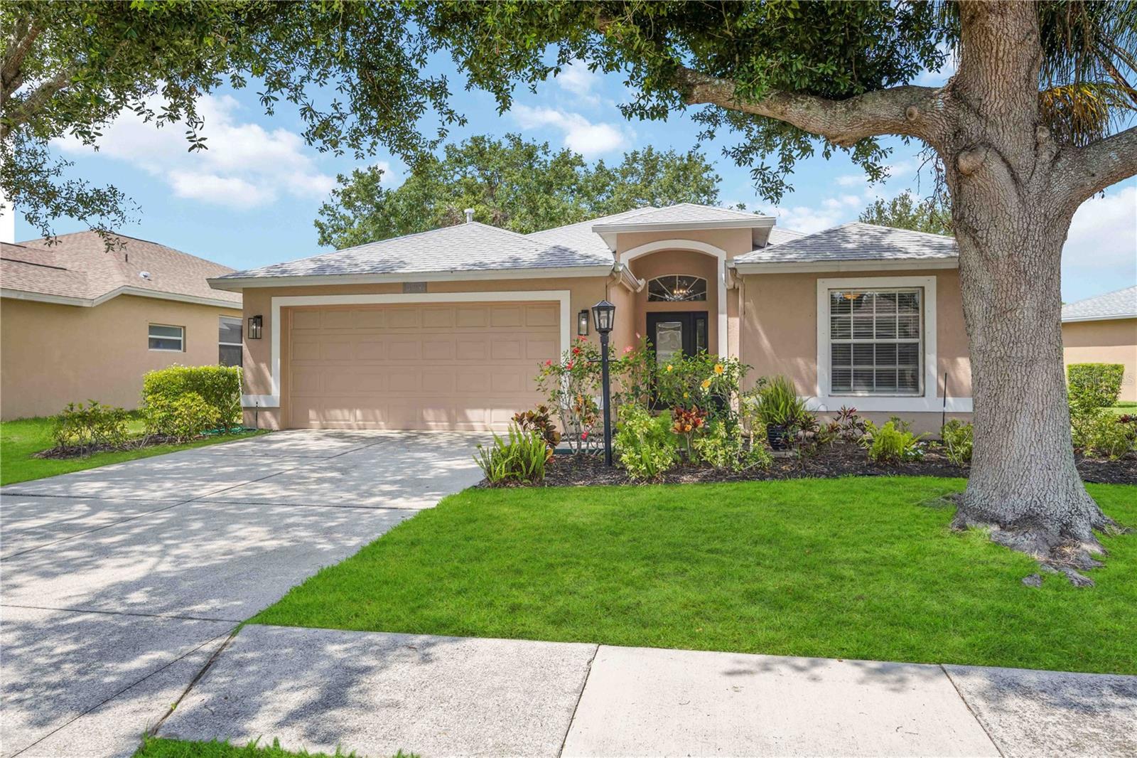 PRICE REDUCTION! BRAND NEW ROOF AND PLETHORA OF UPGRADES! This stunning 3-bedroom, 2-bath home in the highly desirable CARLYLE at the Villages of PALM-AIRE is packed with top-to-bottom upgrades and modern touches, making it the perfect move-in ready retreat—and it won’t last long! Enjoy complete peace of mind with a NEW ROOF (2023), NEW A/C SYSTEM (2024), and NEW WATER HEATER (2024). The beautifully newly renovated kitchen is a showstopper, featuring BRAND NEW STANLESS STEEL APPLIANCES including a GAS range, sleek QUARTZ countertops and island, built-in storage, and a DESIGNER TILE BACKSPLASH—ideal for both everyday living and entertaining. Freshly PAINTED inside and out, this home boasts NEW FLOORING throughout, stylish crown molding, double tray ceilings, and updated light fixtures that enhance its bright, open layout. The spacious living area showcases a dramatic aquarium window with serene pond and preserve views, bringing natural light and tranquil scenery into your daily life. Step out to the brand-new LANAI by DR Aluminum, a peaceful, screened space perfect for enjoying Florida’s year-round sunshine. The luxurious primary suite offers a true escape with a renovated en-suite bath featuring a JACUZZI TUB, walk-in shower, and dual vanities with stone counters. Smart lighting and thoughtful design elements continue throughout the home, creating an upscale yet comfortable atmosphere. Outside, the home is surrounded by lush, meticulously maintained landscaping in a setting that feels like a private oasis. As a resident of Carlyle, you'll enjoy resort-style amenities including a community pool, tennis and pickleball courts, a basketball court, and a playground, with optional Palm-Aire Country Club membership available for golf and social perks. Best of all, this incredible property comes with NO CDD fees, LOW HOA costs, and an unbeatable location close to UTC Mall, Sarasota Airport, I-75, top dining spots, shopping, and world-famous Gulf Coast beaches. This is Florida living at its finest—schedule your showing today before this beautifully updated home is gone!