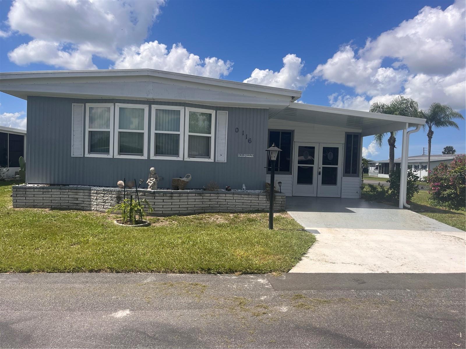 Furnished and ready to move into 2 bedroom and 2 bath unit in good condition. Laminate flooring through out whole unit. Large front family room has a pass thru window from the kitchen. Kitchen and dining room are very convenient to each other for your cooking and dining pleasure. Living room just off dining area and it opens up to the family room to provide lots of space for your family and friends. The main bedroom has a walk-in closet and a separate private bath with a walk-in shower. The second bath has a tub/shower. There is an enclosed lanai just behind the covered carport to provide you even more living space. The laundry room is behind the lanai and has the washer and dryer and a laundry sink. Behind this is a separate storage or workshop which ever works for you. Westwinds Village is a great 55 and older community with a nice clubhouse and large community pool. There is shuffleboard courts and a pool and card room for the residences enjoyment. On site management and maintenance crew to keep everything moving along smoothly. Bring your pets because they are welcomed here. Westwinds is convenient to shopping, restaurants and downtown Bradenton and Sarasota. Come visit this home and community today.