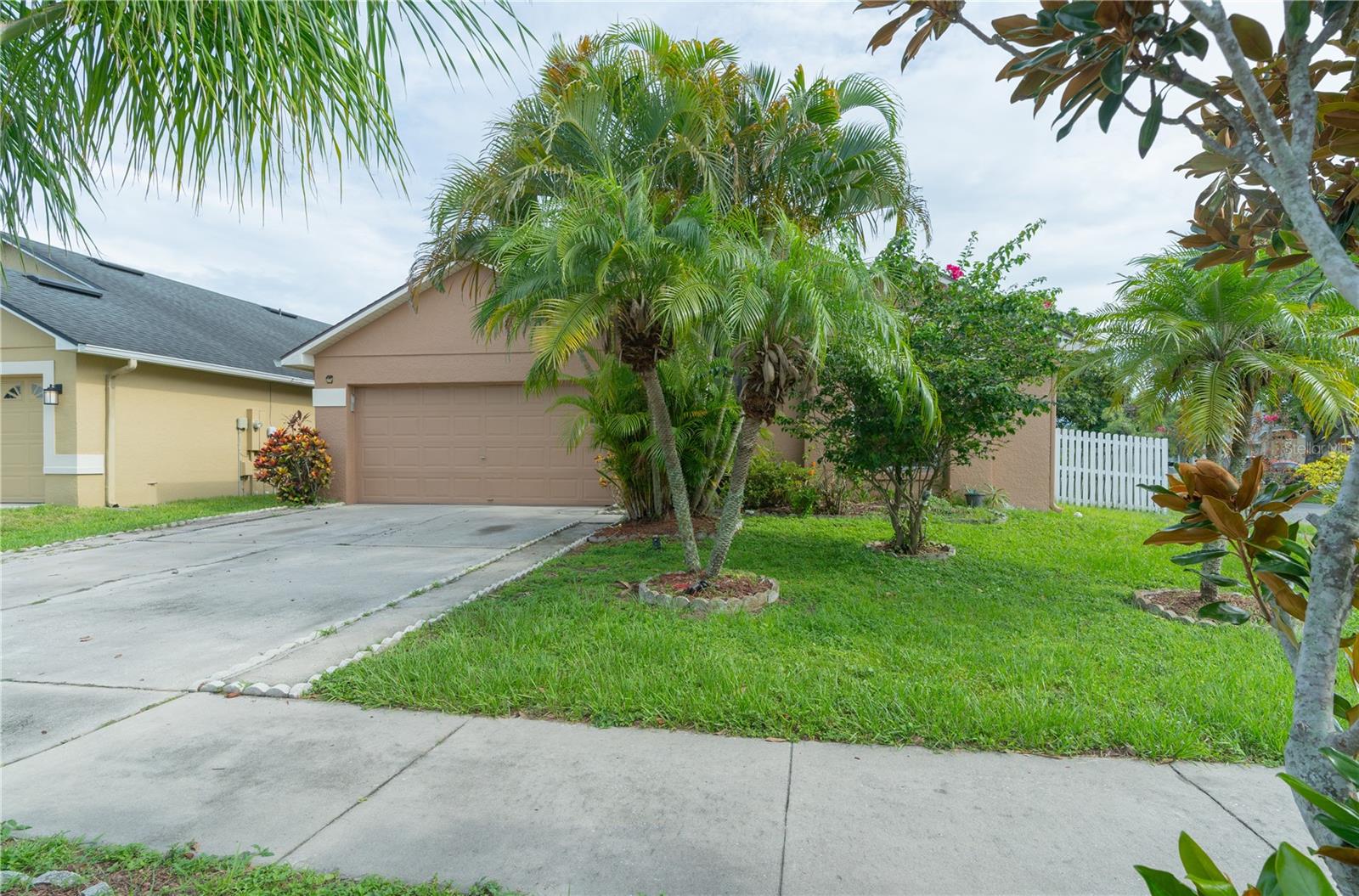 Discover your new home with this spacious and move-in-ready 3-bedroom, 2-bathroom single-family home boasting 1,642 sq?ft of thoughtfully designed living space. This charming residence features durable tile floors throughout, fresh interior paint, and all appliances included for your convenience. The bright and open floor plan leads to a two-car garage and a private backyard. ideal for weekend barbecues or relaxing outdoors. Nestled in the friendly Woodstone subdivision, this home offers effortless access to Orlando International Airport, Vista Lakes, and the vibrant Lake Nona area, making it a perfect fit for professionals, families, or students seeking comfort, convenience, and style in East Orlando.