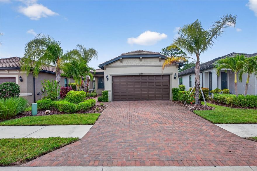 NEW LOWER PRICE!!! Welcome to your dream home—completely turnkey and ready for you!
Nestled in the highly desirable Cypress Falls at The Woodlands, a 55+ gated community, this home offers comfort, style, and vibrant living. The property boasts excellent curb appeal, framed by lush, mature landscaping.

Step inside to discover a flexible bonus room to your left—perfect for a home office, den, or reading nook. Beyond lies a beautifully appointed kitchen, ideal for the culinary enthusiast, featuring modern finishes and a thoughtful layout. The open-concept living and dining areas provide a spacious, inviting atmosphere—perfect for hosting friends and family.

Guests will enjoy a generously sized bedroom with a large closet, conveniently located next to a full guest bathroom complete with a soaking tub. The expansive primary suite offers a private retreat, featuring a spa-like en-suite with a frameless glass shower and an oversized walk-in closet.

Step outside to your lanai oasis—a partially covered, screened-in space with nearly 300 sq. ft. of outdoor living. Enjoy peaceful views of the large pond while sipping your morning coffee, reading a book, or simply relaxing in the Florida breeze.

Beyond your doorstep, Cypress Falls offers an exceptional lifestyle with a wide range of amenities: a stunning clubhouse, resort-style pools, a fitness center, tennis and pickleball courts, bocce, horseshoes, and a full calendar of social events. With a full-time activities director and numerous clubs, you're not just purchasing a home—you're joining a vibrant, active community.

Come see for yourself what makes this home and neighborhood truly exceptional!