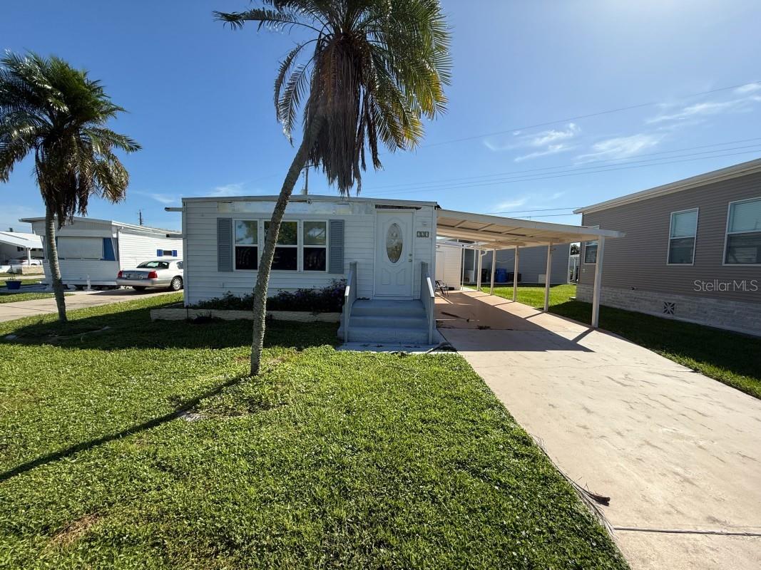 Venice community home with great potential! Featuring 2 bedrooms and 2 baths, this property already has a new main roof (2023) with transferable lifetime warranty. Needs some TLC including carport and shed roof repairs, two windows, AC, and master bedroom walls. Low monthly HOA rent, with pets allowed only as companion animals. Great chance to customize and add value in a desirable location.