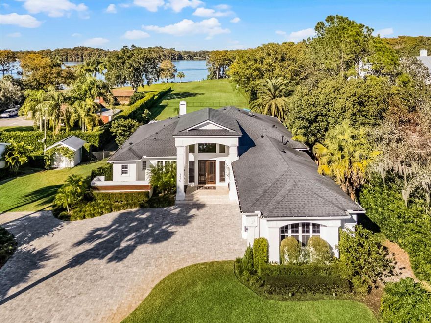 This extraordinary estate, on approximately 2.5-3 acres of meticulously maintained grounds, offers the ultimate in Florida lakefront living. on the serene shores of private 400-acre Lake Howell, this compound features a beautifully renovated four-bedroom, three-bath main house, a spacious three-bedroom, two-bath guest house, and a charming detached art studio/cabana. This secluded lakefront sanctuary is only 10 minutes from downtown Winter Park/Park Avenue. The main house boasts approximately 3,000 square feet with a stunning open floor plan with soaring ceilings and exquisite flooring throughout. The gourmet kitchen is equipped with top-of-the-line appliances, a large island, and flows seamlessly into the dining and living areas. The living room features tall sliding doors, like a wall of glass, which open to a covered lanai with a stone fireplace, ideal for entertaining. Enjoy morning coffees and al fresco dinners on the expansive patio, offering covered and open areas to relax and entertain while taking in the picturesque waterfront, tree-lined views. The gathering room, accessed through double French doors, offers a wet bar and panoramic views of the pool, expansive grounds, and the lake as well. The private primary suite is a retreat with a spa-like en-suite bath and French doors leading to a secluded private patio. There are three additional bedroom suites, and a three-car attached garage complete the main residence. The detached guest house, approximately 1,632 square feet, includes three bedrooms, two baths, a full kitchen, a cozy living room and a large flex room. The wrap-around covered porch is an ideal spot to unwind while taking in the picturesque views. Included is a climate-controlled additional garage, used as a gym. Lastly, there is a third structure on the property, approximately 252 square feet, detached art studio or cabana that overlooks the property's pickleball court, offering a peaceful setting for creative pursuits. The grounds are a private paradise, with a palatial lawn leading to a two-story boat dock with a boat lift and observation deck, ideal for fishing, boating and lakefront recreation. This compound offers the best of both worlds as a tranquil lakeside retreat just five miles from Winter Park’s iconic Park Avenue, 20-25 miles from downtown Orlando and 15 miles from Orlando International Airport. Live the Florida lifestyle in this one-of-a-kind lakefront sanctuary! Total air-conditioned space for all three buildings is approximately 4,900 square feet. Note, additional features sheet, floor plans and survey available upon request!