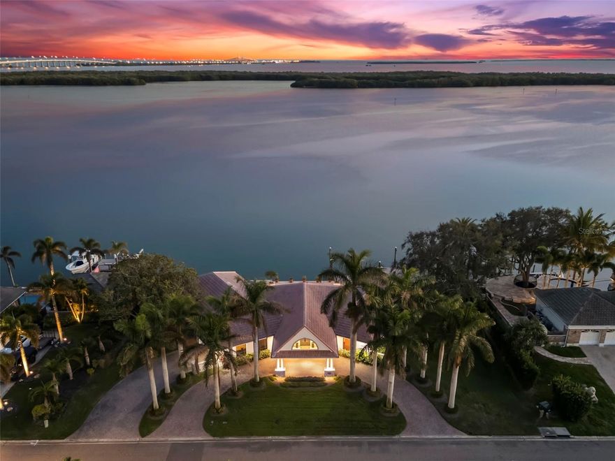 **PRICED UNDER RECENTLY APPRAISED VALUE** **SELLER OFFERING AN ADDITIONAL $20,000 BUYER CREDIT** 

Experience LUXURY in this 3 BEDROOM, 4 BATH 3,822 sq. ft POOL HOME in the EXCLUSIVE BAYWAY ISLES. This homes features 156 FEET OF WATER FRONTAGE, PRIVATE DOCK with DEEP WATER GULF ACCESS, with gorgeous UNOBSTRUCTED WATER VIEWS. This estate is situated on a large, NEARLY 1/2 ACRE OVERSIZED LOT, in a secure, 24-HOUR GUARD GATED , ISLAND COMMUNITY. This well maintained home seamlessly blends mid-century modern interiors with timeless charm. It boasts breathtaking views & direct access to the beautiful waterways of Tampa Bay. This home is nestled on a rare oversized 1 and 3/4 lot. It offers unparalleled open water views of Tampa Bay.  As you arrive to this property, you will begin to notice each carefully crafted detail. The circular drive way is lined with mature Royal Palm trees. You will be greeted under the custom porte-cochère covered entryway. Upon crossing the front door threshold, you'll be welcomed by the grandeur of this home's rotunda foyer. The eye-catching CUSTOM TERRAZZO FLOORING seamlessly complements the exquisite oak hardwood flooring that graces the rest of this estate. The home is filled with natural light making it an amazing space for the Art Collector. Enjoy true indoor/outdoor living with an OPEN FLOOR PLAN, that seamlessly connects your living spaces to the stunning outdoors & unobstructed views of Tampa Bay. The kitchen is beautifully appointed with Subzero Refrigerator, European appliances, and a temperature controlled WINE CELLAR. There is CUSTOM CABINETRY throughout this residence as well as a central vacuum. It boasts cedar-lined closets in the Primary and Secondary bedroom and  electric HURRICANE SHUTTERS on all rear exterior windows. Unwind by the pool with a picturesque water vista. Jump into your boat from the private dock with deep-water access for a short ride to the Gulf of Mexico. Florida living doesn’t get much better than this! Secure your private showing today to indulge in the pinnacle of LUXURY living!