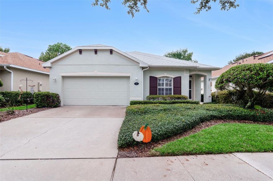 St. Joe 3 Bedroom/2 Bath Cardinal floor plan with a fenced backyard that has been impeccably maintained & a fabulous conservation area view within the Victoria Gardens 55+ neighborhood. Features include luxury vinyl flooring, New Roof & Water Heater replaced on 10/2023, A/C condenser 18’, Plantation style shutters, 5” baseboards, ceiling fans in all Bedrooms/Great Room/Lanai, “no carpet”, water softener & a filtration system. The Light & Bright 17'x 21' Great Room allows you flexibility for furniture placement. Kitchen offers 42" Cherry cabinets w/ crown molding & a 4-burner natural gas range. Primary suite provides a tray ceiling, walk-in closet w/ organizer & an en suite with raised height vanity, dual sinks & a spacious glass enclosed walk-in shower w/ bench seat & a grab bar. You will enjoy your morning coffee or late afternoon beverage on the 17'x 8' screened enclosed covered patio with a remote-controlled shade overlooking the fenced backyard & a scenic conservation area view. Utility room has storage cabinets, washer, electric dryer & a natural gas connection for the future. The 20’ x 21’ garage offers a laundry tub & storage shelving. Victoria Garden residents have access to their own Private Clubhouse. HOA fee includes lawn care, Spectrum HFC TV & internet, and reclaimed water for yard irrigation. Community is within 1 mile of I-4 that offers great access to the east coast beaches, Orlando (40 minutes) and 3 International airports within 1 hour.