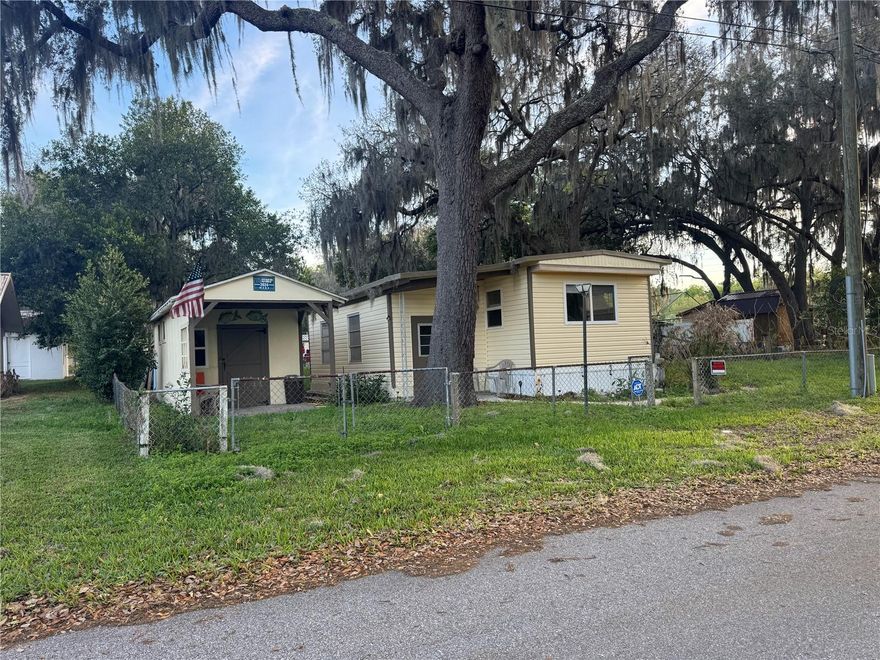 Charming 2-bedroom, 1-bath mobile home with bonus room that can be used as an office or additional bedroom. Ideally located directly across from Lake Hernando and surrounded by nature. This home offers a comfortable layout with a functional kitchen featuring newer appliances, central A/C, and durable vinyl plank flooring throughout. Recent updates include a new well pump, water conditioner, and double-pane windows for easy cleaning, adding value and efficiency. Vinyl siding for durability and a fully fenced yard provides privacy and space to enjoy the outdoors, along with two sheds for storage or workshop use. NO HOA. Located in X500 flood zone. It has already been inspected for buyers convenience, inspection report is available. Previously rented for $1,100/month, making it a solid opportunity for investors or buyers seeking an affordable property with potential.