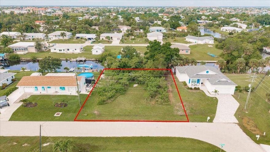 Exceptional waterfront building lot in the sought-after Charlotte Park community of Punta Gorda. Spanning just over 10,000 square feet with 80 feet of waterfront, this property offers power boat access to Charlotte Harbor and on to the Gulf of Mexico—an ideal setting to create your dream coastal retreat. Tucked away on Chapman Boulevard, a quiet dead-end street, the lot offers added privacy and minimal through traffic. The wide frontage provides plenty of space for a spacious residence with endless design possibilities, maximizing sweeping water views from every angle. Boating, fishing, and water sports are right at your doorstep, offering the true Florida lifestyle. Beyond its waterfront appeal, the property is conveniently located near shopping, dining, entertainment, and recreational options. You’ll also be just a short drive from pristine Gulf beaches, golf courses, and scenic nature parks. Don’t miss this rare opportunity to build your custom waterfront home in one of Punta Gorda’s most desirable locations. Whether for a full-time residence or seasonal getaway, this lot is the perfect canvas for your vision.