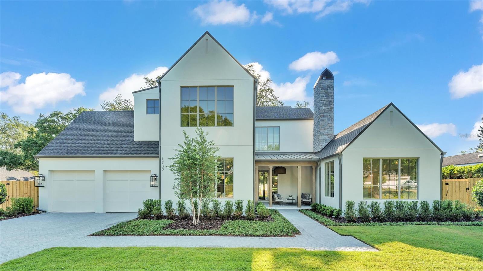 Welcome to this exquisite 5-bedroom, 5.5-bathroom home built by Lundev, perfectly situated in the highly sought-after Timberlane Shores neighborhood of Winter Park. Spanning 4,080 square feet, this property offers the ultimate blend of luxury and comfort. Thoughtfully designed for both entertaining and everyday living, this home features high-end finishes and top-quality craftsmanship throughout.
Upon entering, you're greeted by a charming front porch with a cozy fireplace, setting the tone for the warmth and elegance that continues inside. This inviting outdoor space is perfect for relaxing with a morning coffee or enjoying cool evenings with friends and family. Step inside to find a spacious great room, ideal for gathering and entertaining, boasting ample natural light and a seamless flow to the rest of the home’s main living areas.
The gourmet kitchen is a chef’s dream, boasting high-quality appliances, a wine cooler, refrigerator drawers, and a casual café area for everyday dining. The adjacent formal dining room offers a sophisticated space for hosting elegant dinner parties and holiday gatherings. These thoughtfully designed spaces ensure that every meal and event is special.
The luxurious primary suite is conveniently located on the first floor, providing a tranquil retreat with easy access. It features a spa-like bathroom with double sinks, a soaking tub, a shower, a linen closet, and a large walk-in wardrobe for ample storage. Additionally, on the main floor you will also find a detached bedroom or office with an en-suite bathroom, built-in closet, and private entrance offering flexibility and making it ideal for guests or as a private workspace.
Upstairs, you’ll find three aditional bedrooms, each featuring its own en-suite bathroom and walk-in closet, providing comfort and privacy for all occupants. A versatile loft/den area on the second floor adds extra living space, perfect for a home office, playroom, or relaxation area, catering to various lifestyle needs.
The outdoor area is an entertainer's paradise, complete with a private pool & spa, a cabana with a pleasant fireplace, and a summer kitchen for alfresco dining and entertaining. Whether hosting a barbecue or enjoying a quiet afternoon by the pool, this space is designed for relaxation and enjoyment. With its great location, this home offers excellent proximity to Blue Jacket Park, Baldwin Park, and the vibrant Park Avenue, known for its entertainment options, shops, and restaurants. Experience luxury living in one of Winter Park's most coveted areas. Schedule your private tour today to see this stunning property in person!