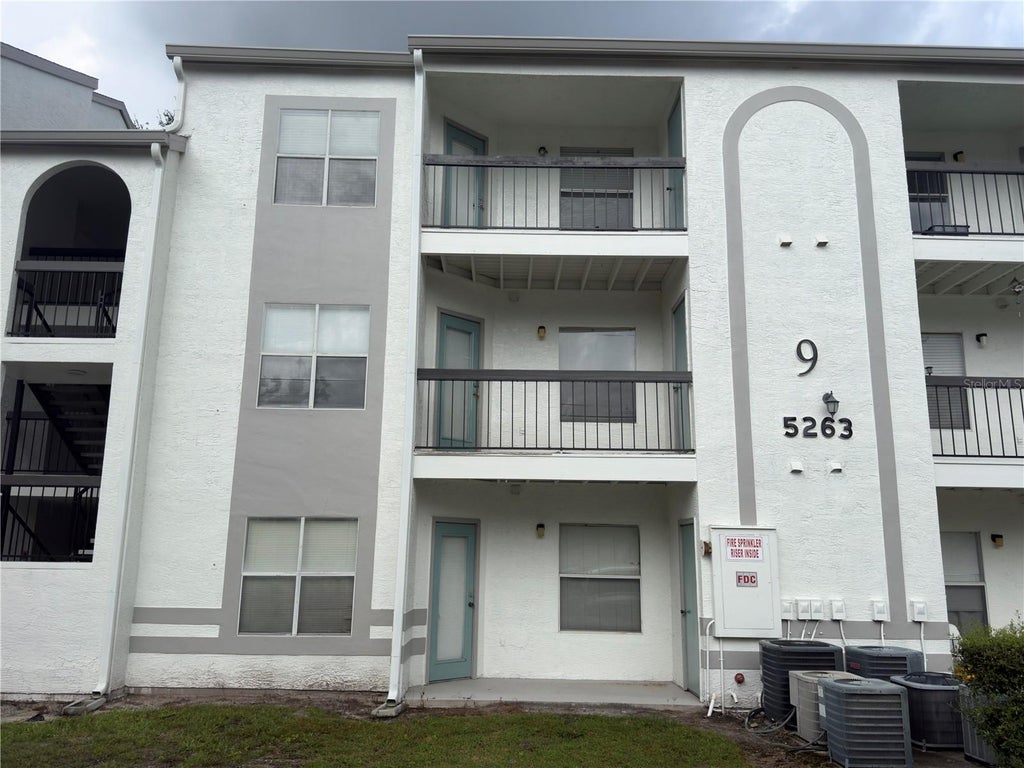 Photo of 5263 Images Circle #303, Kissimmee, FL 34746 (MLS # O6452153)