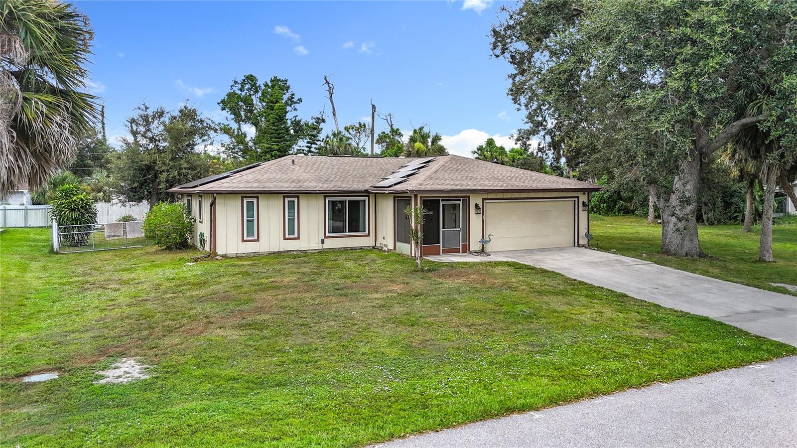 New Roof in 2022, converted mancave inside the garage. With a pool cage on a double lot property. The
property also has Impact windows, new attic plumbing water lines from 2023. Great opportunity to own a
pool home, featuring a lovely 2-bedroom, 2-bathroom, 1,208-square-foot home located on a wooded
half-acre lot. The spacious family room opens up to the kitchen/dining room area with wood laminate
flooring and French doors out to the pool, jacuzzi/lanai area. The kitchen features an abundance of natural
hardwood cabinets, Corian countertops, a wine rack, a breakfast bar, a lighted tray ceiling, and a
serving window to the pool. The master bedroom also with wood laminate flooring and features a large
walk-in closet. Master bath with extended vanity has a his and her sink area and a large walk-in tiled
shower. The guest bedroom is roomy with brand new carpeting, a ceiling fan, plenty of closet space,
along a full guest bathroom. Outside is perfect for entertaining, featuring a sparkling in-ground
swimming pool and an additional patio area. Additional features include a storage shed, gated and fenced
around the property, a 2-car garage with laundry facilities, a utility sink, and a screen door. Plenty
of additional outdoor space to park your boat, R/V, or other toys. Conveniently located to US-41 and
I-75, shopping, schools, entertainment, beaches, golf, and more. NOTE: Room sizes are approximate and
are provided for estimation purposes only. They may not reflect the exact measurements. Contact Listing Agent.