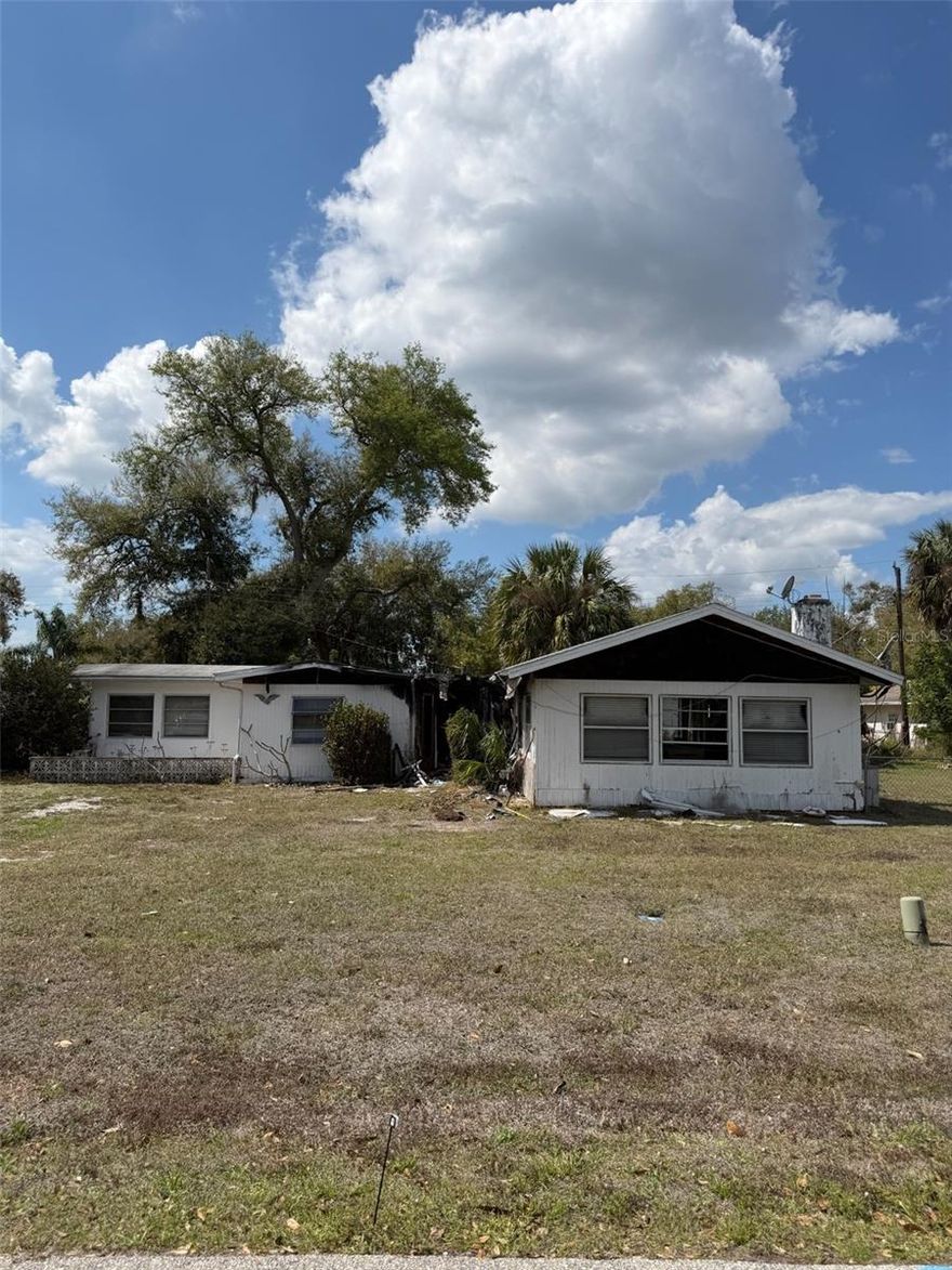 Investor Special! Cash-only opportunity on over half an acre in Punta Gorda with no HOA or CDD and located in an X flood zone (no flood insurance required). This 3-bedroom, 1-bath home has fire damage (Only part of the home, rest is smoke damage) and is ready for renovation, offering incredible potential for investors, flippers, or buyers looking to rebuild and create their own space.
Part of the yard is already fenced in, and the large lot provides flexibility for future improvements.

Conveniently located just a short drive to historic downtown Punta Gorda, where you’ll find waterfront parks, popular restaurants, shopping, and year-round entertainment. Enjoy easy access to beautiful Gulf beaches, boating, fishing, golf courses, and the Punta Gorda Airport, making this location ideal for both full-time residents and seasonal visitors.

Bring your vision and take advantage of this unique opportunity to create your ideal property in Punta Gorda!