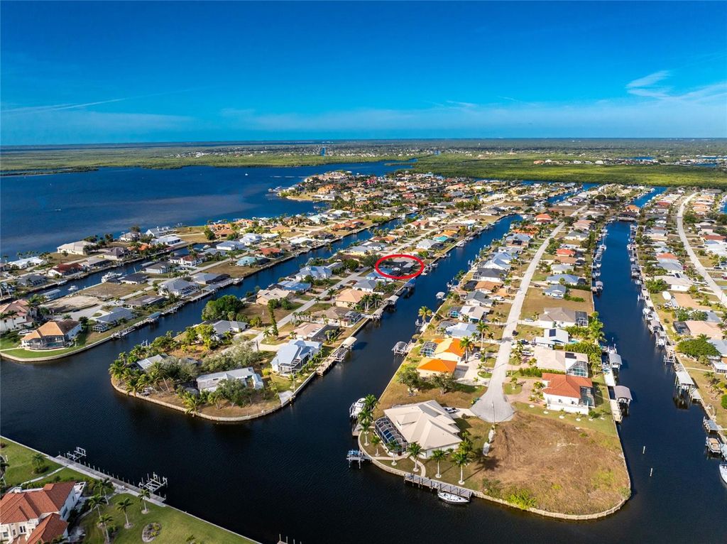 Photo of 128 Sinclair Street SE, Port Charlotte, FL 33952 (MLS # C7519224)