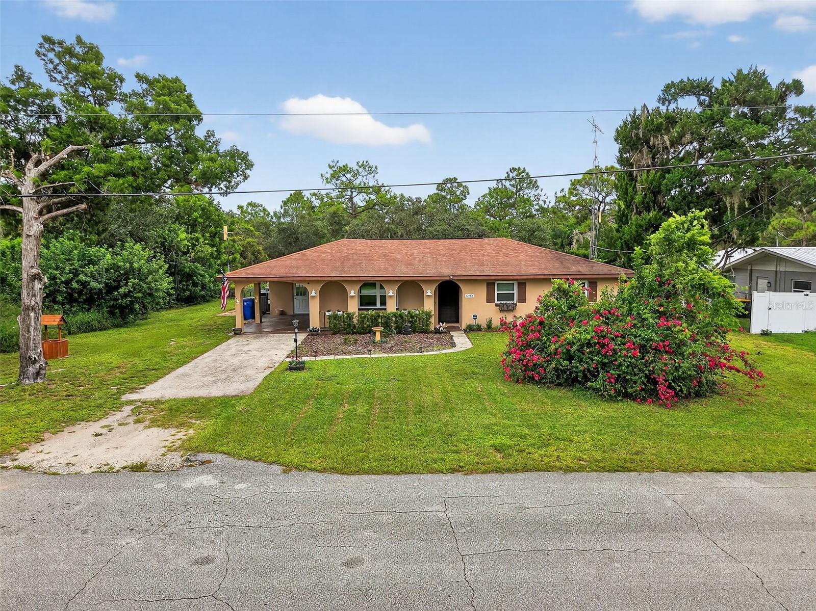 Welcome to 6404 Mat Tee Drive, a stunning retreat that blends style, comfort, and effortless living.
Set on a beautifully landscaped quarter-acre lot, this three-bedroom, two-bath ranch is packed with personality. From the inviting front porch to the screened-in saltwater pool and heated spa out back, every inch of this home is designed to help you relax and enjoy.
Inside, natural light fills the open layout, highlighting a mix of luxury vinyl and ceramic tile. The kitchen is both functional and stylish with modern appliances, a built-in water filtration system, and space for casual dining. A spacious Florida room offers over thirty feet of extra living space—ideal for entertaining, lounging, or creating your dream setup.
The primary suite features a built-in closet and en-suite bath, while two additional bedrooms provide comfort and flexibility. Smart home features, a full security system, energy-efficient windows, and a smart thermostat ensure peace of mind and year-round comfort.
With a private pool oasis, access to Lake Charlotte, and plenty of space to live and entertain, this home isn't just a place to live—it’s a place to love.