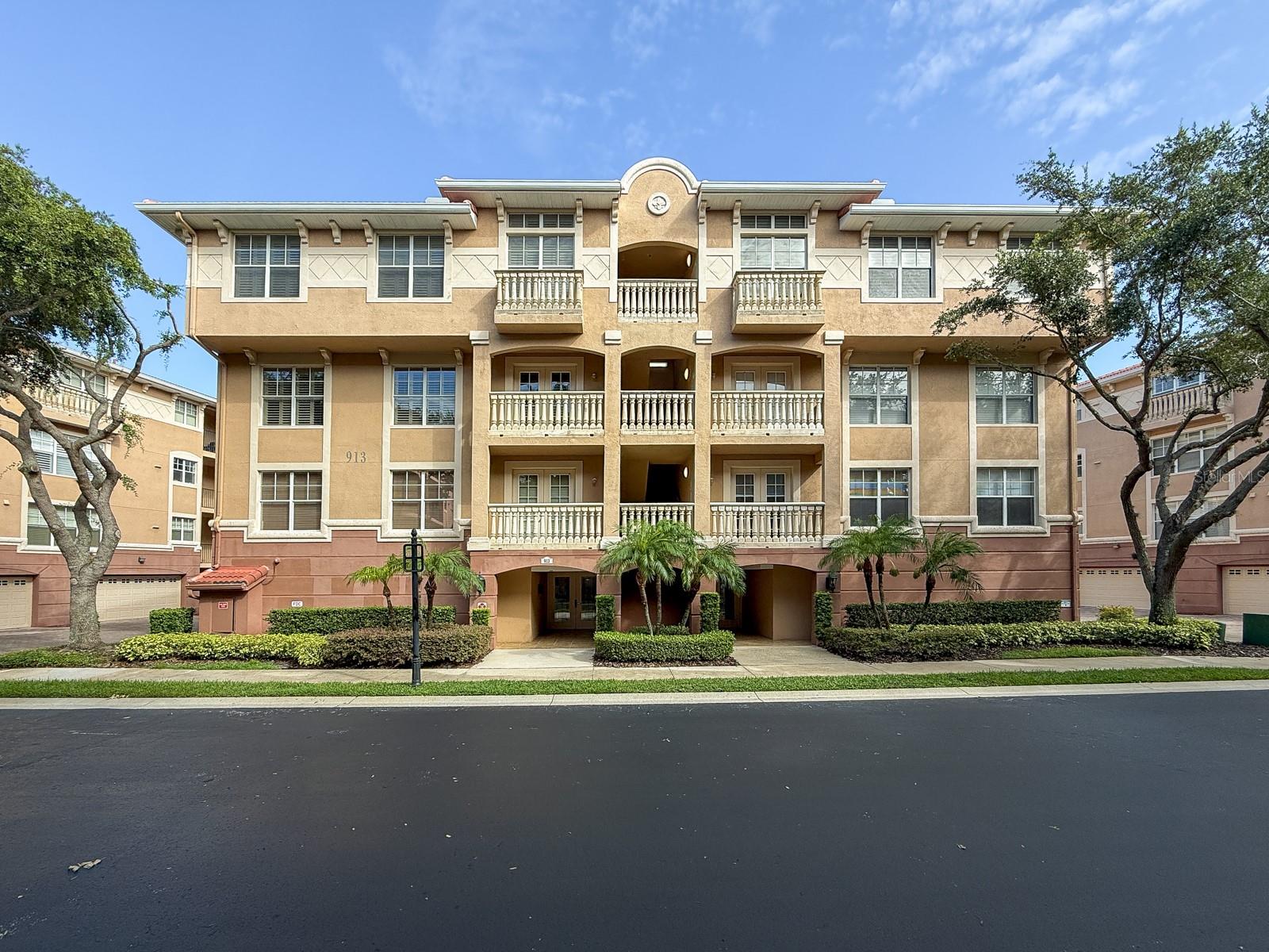 A rare opportunity to lease in the sought-after, gated, Lotus Vista community! Elegant penthouse living awaits in this stunning 3-bedroom, 2-bathroom condominium, complete with an office, a den, a formal dining room, and a living room—ideal for both everyday comfort and entertaining. Set on the top floor, where you can take the elevator directly to your front door, this end unit offers breathtaking views of the Lake Lotus Preserve from the kitchen, living room, primary suite, and expansive wrap-around balcony—perfect for savoring sunsets and peaceful mornings surrounded by nature. Rich wood floors, crown molding, and soaring ceilings create a warm and refined ambiance, complemented by abundant natural light throughout. The beautifully appointed kitchen is a chef’s dream, featuring granite countertops, stainless steel appliances, 42” wood cabinetry with under-cabinet lighting, a built-in wine rack, and a breakfast bar that seamlessly connects to the casual dining area and multiple flexible living spaces. The primary suite is a private retreat with stunning views, a spa-like en-suite bath with a jetted tub, walk-in shower, dual vanities, and generous closet space. Plantation shutters, solar shades, and a dedicated laundry room add both elegance and convenience. A two-car garage offers direct access into the building, and a shared storage unit provides extra functionality. The HOA covers water, high-speed internet, and premium cable, while resort-style amenities include a recently renovated clubhouse, sparkling pool, and an active social calendar with weekly events and monthly luncheons. Conveniently located near Lake Lotus Park—with scenic walking trails, lakeside picnicking, fishing, and playgrounds—and just minutes from shopping, dining, major highways, and medical facilities, this residence delivers carefree luxury living at its finest.
