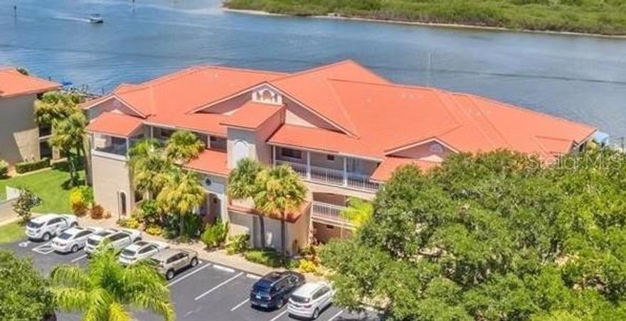 Welcome to Waterfront Resort-Style Living at Bouchelle Island!
This beautifully updated 2-bedroom, 2-bath corner unit offers the perfect blend of comfort, coastal charm, and convenience in one of New Smyrna Beach’s most desirable communities. Located on the second floor, Unit 201 captures abundant natural light, enhanced privacy, and peaceful views of the tropical surroundings.

Resort-Style Community Amenities:
Bouchelle Island is known for its vibrant lifestyle and unmatched amenities, including:
• Two heated pools
• Fitness center
• Clubhouse
• Tennis and pickleball courts
• 18-hole chip-and-putt course
• Riverwalk promenade
• Boat slips (based on availability)
• On-site marina
• Gorgeous views of the Intracoastal Waterway