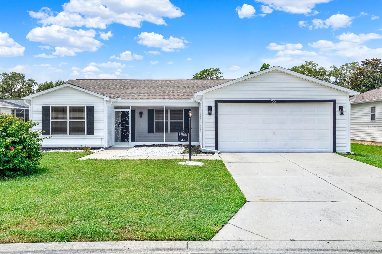 One or more photo(s) has been virtually staged. Welcome to 766 Artesia Avenue in The Villages, Florida! This stunning, fully renovated 3-bedroom, 2-bathroom home is located in the highly desirable Summerhill Village, a vibrant 55+ community designed for active adult living, and buyer approval is subject to age verification. Completely rebuilt in 2025 with thoughtful upgrades and modern finishes throughout, this home features a newer roof, 10-foot vaulted ceilings, new LED ceiling fans in every room, recessed lighting, and waterproof laminate flooring that is perfect for pets and easy to maintain. The chef’s kitchen is a showstopper, with granite countertops, a granite island, and brand-new stainless steel appliances, including a gas stove, while the bathrooms have been fully renovated with stylish barn-style vanities and modern finishes. Major systems including the AC, electrical, and gas water heater are all new in 2025, ensuring comfort and peace of mind for years to come. Outdoor living is exceptional with a double back lanai, half covered with a ceiling fan and half open for sunbathing, a front lanai with a ceiling fan perfect for relaxing, and a spacious enclosed Florida room that flows seamlessly into the lanai for a true indoor-outdoor lifestyle. This home is perfect for retirees looking to socialize, stay active, and enjoy everything The Villages has to offer, including access to hundreds of pools, countless golf courses, beautiful clubhouses, fitness centers, tennis, pickleball, bocce, and over 25 district amenities—all included with the $199 monthly amenity fee. With a thriving social scene, endless recreational opportunities, and a secure, welcoming community, 766 Artesia Avenue offers the ideal combination of a beautifully upgraded home and the unparalleled lifestyle of one of Florida’s premier active adult communities. Schedule your showing today and experience it for yourself!