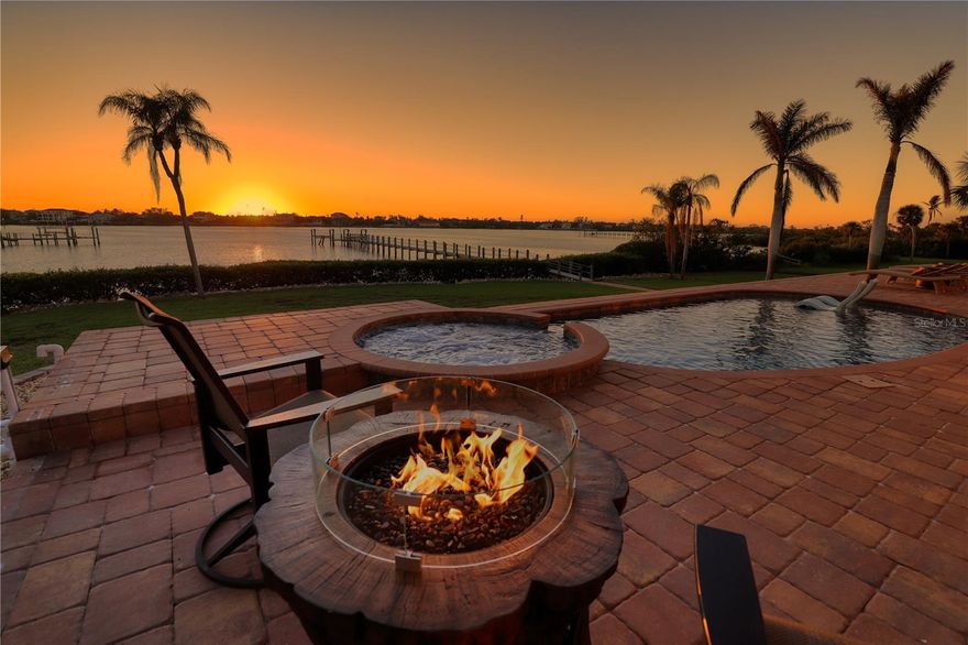 A Rare Waterfront Masterpiece of Coastal Architecture on Lemon Bay. 
In a world craving escape, discover a rare opportunity to claim your own slice of paradise - a magnificent waterfront estate on over an acre of Lemon Bay's widest expanse, where the gentle rhythm of waves and spectacular sunsets compose a daily symphony of peace. This exquisite Englewood, Florida, retreat, reborn through a meticulous 2+ year renovation that epitomizes quality and sophistication, beckons the luxury buyer seeking a serene haven: a harmonious blend of privacy, resilience, and coastal elegance, where tranquility reigns supreme yet life's finest amenities are just minutes away.
The completely rebuilt 2-bedroom, 2.5-bath main residence stands as a masterpiece of coastal architecture, elevated to 13 feet with a 7-inch engineered concrete pour for enduring grace and optimal insurance coverage-including a transferable flood policy that has proven its mettle with no water intrusion during the last 3 named storms. Awaken in the expansive primary suite, where unobstructed bay views frame your dreams, and a spa-like bath envelops you in indulgent calm.  The chef's kitchen, a heart of passion and precision, features Signature custom rift-sawn white oak cabinetry, Cambria Inverness Gold surfaces, an 8-burner Wolf range with bespoke Rutt hood and hutch, Sub-Zero refrigeration, duel dishwashers, a 5-foot Galley workstation sink, Brizo pot filler, and undercounter microwave drawer-flowing seamlessly into open living and dining spaces ideal for intimate gatherings.
Step through the dramatic 16-foot sliding glass wall to a resort-level outdoor sanctuary: a shimmering saltwater pool, infinity spa, and luxurious covered outdoor kitchen clad in stunning Nacardo quartzite, where evenings under the stars become cherished memories, warmed by 2 freestanding firepits.  Enriched amenities abound, including a versatile bonus room perfect for billiards, an expansive laundry/mudroom with abundant storage, a walk-in pantry, guest closet, and secure safe room-every detail crafted to elevate your daily living.
For multi-generational bliss, VIP guests, or premium rental allure, the independent 2-story, meticulously updated guest residences offer self-contained retreats: a lower level with 2-bedrooms, 1-bath, full kitchen, laundry, and an upper level with 1-bedroom, 1 bath, and full kitchen. The guest property offers its own private saltwater pool, infinity edge spa, and convenient RV pad ensure independence harmonizes with the estate's cohesive charm.
Sustainability and modern resilience define this legacy property: new metal roof, new main house lanai pool cage with panoramic view, electric, plumbing, closed-cell foam insulation, hurricane-impact windows/doors, and exterior hurricane straps; a 1000 gallon propane tank powering the estate alongside a 3-year-old 500 gallon tank fueling the Wolf range, outdoor kitchen, tankless water heater, and firepits; plus whole-house generators for uninterrupted comfort.
More than a home, this is an unparalleled serene retreat-a private sanctuary where craftsmanship meets soul-stirring tranquility, ideally situated near private and commercial air travel in Venice, Sarasota, and Punta Gorda. Located between Venice and Englewood's charming boutiques, gourmet dining, and cultural gems. For the discerning buyer yearning for a peaceful escape that whispers luxury, legacy, and effortless connection, let this rare Lemon Bay gem become yours.