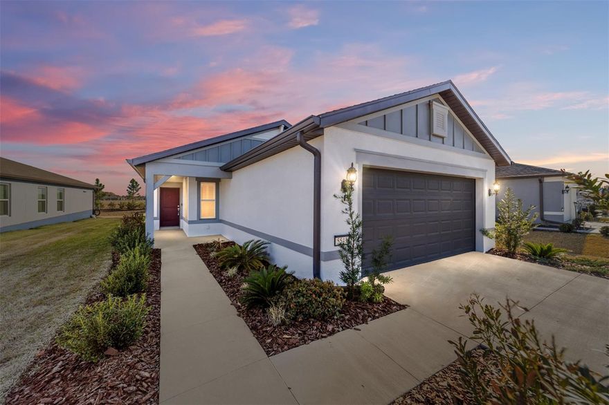 Welcome home to comfort, connection, and carefree living with peaceful views and no neighbors directly behind you! This exceptional Daylen model is tucked inside the gated 55+ Stone Creek Golf Course Community, where resort-style amenities and a vibrant, social lifestyle are part of everyday living. This thoughtfully designed home offers a seamless open-concept layout that enhances everyday living and entertaining. Natural light fills the space, complemented by Plantation shutters, recessed LED lighting, upgraded ceiling fans, and luxury vinyl plank flooring throughout. The designer kitchen showcases a large center island with stylish pendant lighting, a single-bowl sink with an upgraded faucet, Shaker-style cabinetry, sleek quartz countertops, herringbone tiled backsplash, a pantry for storage needs, and Whirlpool stainless steel appliances. Sliders in the gathering room allow easy access to the no-see-um privacy screened lanai, ideal for morning coffee, evening breezes, or hosting friends outdoors. With 4 bedrooms and 2 baths, this home offers ample space perfect for a hobby room, den, or home office space, and the layout offers privacy and flexibility. The sunlit Owner’s suite features a large walk-in closet and a spa-inspired bath with dual sinks, quartz-topped counters, a comfort height commode, and a step-in tiled shower with a seating ledge. Additional perks include a whole-home water softener system, a Smart Home technology package with a video doorbell, and a 4-foot extended two-car garage with epoxy-coated flooring and room for your golf cart. Monthly HOA fees even include Spectrum cable and internet, giving you one less thing to worry about. Embrace the exceptional lifestyle of this vibrant community, featuring a 24/7 staffed gated entrance for security and peace of mind. Luxury-inspired amenities include heated pools, a state-of-the-art fitness center, a spa, and relaxing hot tubs and saunas. Stay active with pickleball, bocce, tennis, and softball field, while a dedicated lifestyle staff curates entertainment, activities, and special events to foster connections. Just beyond the gates, enjoy a golf course, pro shop, and restaurant—perfect for socializing and unwinding. Make your move today and experience resort-style living at its finest!