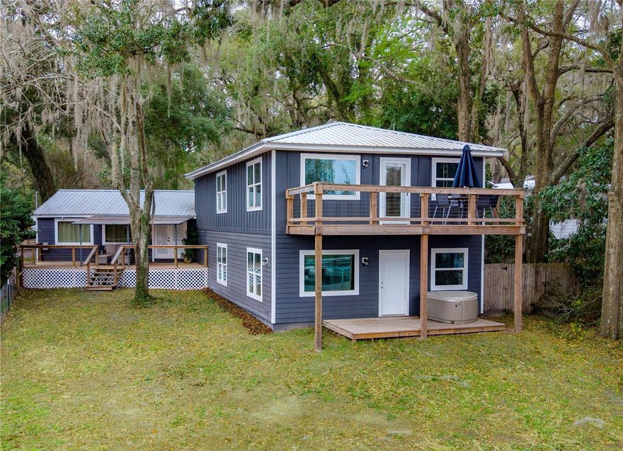 This home has it all, location & plenty of space. 4 bedroom 3 bath home boast over 3200 SF of living space with views of lake geneva. Completely remodeled in 2023. Large open kitchen, large living space, great size bedrooms, huge great room/game room and decks off each of the living areas great for entertaining family & friends. All 3 bathrooms have been updated to provide that modern fresh feeling. This home offers lots of character and a great home for entertaining. Grab a cup of coffee or a good book and sit out on 1 of 3 porches with views of lake geneva or watch the gorgeous sunsets. This roomy lot is great for pets and plenty of room for your toys. Roof (2023) AC (2023) HW Heater (2023) Septic pumped (2026). Don't miss your opportunity to own this great home only 1/2 mile to down town keystone, 20 min to gainesville. Give us a call for your private tour.