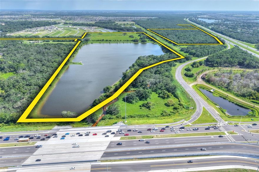 Positioned at one of Tampa Bay’s most dynamic growth corridors, this rare 117± acre offering lies at the high-visibility intersection of I-75 and Big Bend Road in Riverview, Hillsborough County. Its unmatched scale, access, and location make it an exceptional candidate for major sports, recreational, medical, educational, or community-based developments. Included within the property are 12 developable acres ready for up to 188 residential units or 50,000–75,000± square feet of non-residential use.

Beyond its development opportunities, the land offers a park-like setting just minutes from the interstate yet remarkably private. A scenic 30± acre lake, Bullfrog Creek meandering through oak hammock preserves, and wide stretches of open pasture provide a rare balance of recreation, natural beauty, and long-term investment value.

As one of the last large acreage tracts available in Tampa’s core growth corridor, and with significant residential and commercial expansion already underway nearby, this property represents a true crossroads of lifestyle and opportunity.