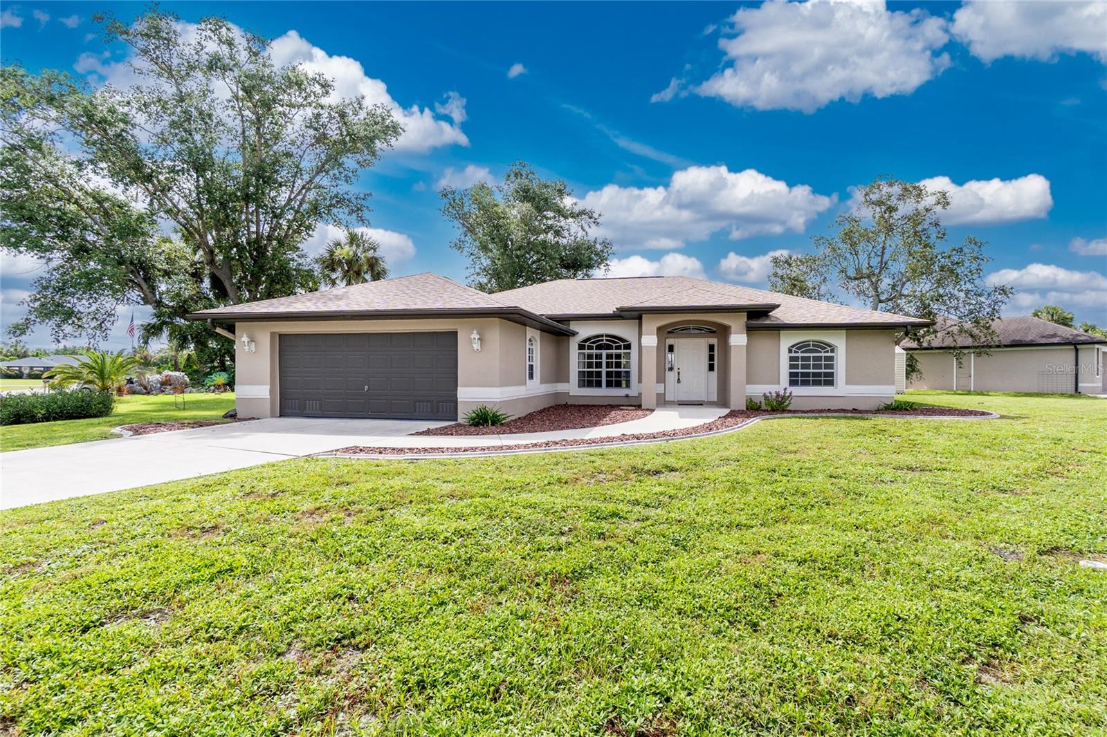HIGH & DRY... Welcome to this beautiful 3 bed 2 bath open concept pool home in a quiet neighborhood in PC. This home sits on a oversized corner lot with tons of space to store your toys. Home is fully secure with hurricane shutters, new Roof (2022) Water Heater (2025) New sprinkler heads (2025) Epoxied Garage Floor (2025) New appliances. Primary Bath offers dual sinks, walk in shower. Sit in the oversized screened Lanai with your morning coffee and enjoy the fish jumping in the canal or just relax in the amazing pool and soak up the sun. Close to a public Boat ramp. Close to Beaches, Stores & Restaurants and the new Sunseekers resort.