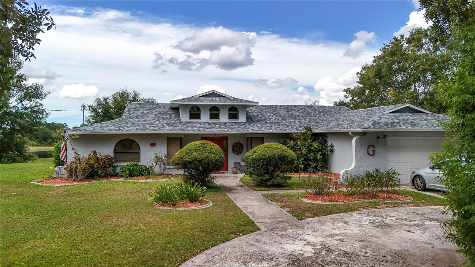 SPRING HILL POOL HOME! AND it's on a LAKE! This 3 bedroom 2 bath home with a BONUS ROOM that can easily be used as a 4th bedroom is a MUST SEE! Almost 3/4 of an ACRE overlooking FARGO LAKE! BRAND NEW ROOF (2025) with HIGH IMPACT shingles! NEW AC (2025).. In ground POOL fully screened.. HIGH ceilings.. Ceiling fans THROUGHOUT.. UPDATED bathrooms with GRANITE countertops.. UPDATED kitchen with GRANITE countertops and STAINLESS STEEL appliances.. HUGE 2 car garage.. OVERSIZED CORNER LOT.. AND a SPACIOUS CIRCULAR driveway for PLENTY of extra parking.. ALSO a SHED with WORKSHOP area for your convienience! VERY close to shopping, medical, restaurants, etc.. Also just a SHORT DRIVE to Hernado beach and the WEEKI WACHEE water parks. EASY ACCESS to the SUNCOAST PARKWAY as well! This PROPERTY is AMAZING and a MUST SEE! Make your appointment today..