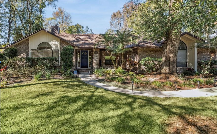 One or more photo(s) has been virtually staged. Welcome home to this stunning 4-bedroom, 3-full bath pool home located in the highly sought-after Chelsea Woods community of Tuscawilla! Situated on an oversized corner lot, this property offers a fully fenced backyard framed by majestic shade trees, providing exceptional privacy and charm. Designed for both comfort and entertaining, the outdoor living space is a true highlight, featuring a screened-in pool, artificial turf with a putting green, and a fire pit—perfect for year-round gatherings.  Inside, enjoy a desirable split-bedroom floor plan with a spacious primary bedroom and en suite. The open living areas are filled with natural light and showcase vaulted ceilings, skylights, and a cozy fireplace that adds warmth and character. The large kitchen offers ample counter space, generous storage, and stainless steel appliances—ideal for the home chef! Seamlessly blending indoor comfort with exceptional outdoor living, this home is a rare opportunity in one of Tuscawilla’s most desirable neighborhoods.