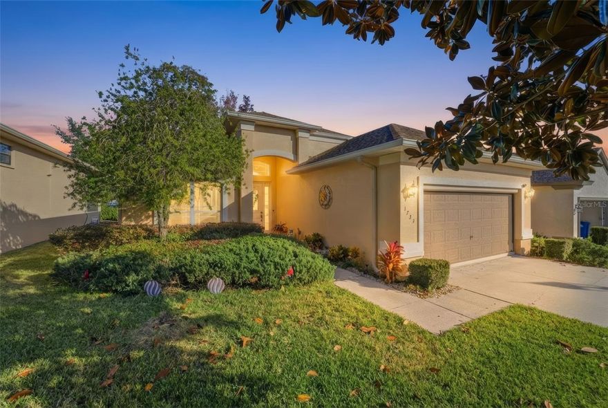 Nestled within the Davis Reserve at Citrus Hills, this beautifully maintained home invites you to slow down and enjoy the ease of Florida living on a thoughtfully sized 0.14-acre lot. From the moment you arrive, the well-kept lawn with an irrigation system, neatly trimmed shrubs, and established plant beds frame a welcoming exterior, while a wide driveway leads to a two-car garage and a front entry set slightly back for added privacy and depth. Inside, the foyer opens with a blend of tile flooring and an immediate sense of space as vaulted ceilings draw your eyes upward and natural light fills the home. The open-concept living area features vinyl flooring, soaring ceilings, dramatic floor-to-ceiling windows, and sliding doors that extend the living space into the Florida Room, creating a seamless indoor-outdoor flow. The kitchen is both functional and inviting with tile flooring, solid countertops, solid wood cabinetry, stainless appliances, a kitchen bar, and a spacious center island ideal for everyday living and entertaining, while the adjacent breakfast nook serves as the main dining area, surrounded by floor-to-ceiling windows that fill the space with natural light. The primary suite offers a true retreat with wood flooring, dual walk-in closets, and private access to a screened-in lanai where mornings feel calm and unhurried, complemented by a spa-inspired en suite featuring tile flooring, dual vanities, and a glass-enclosed step-in shower. A second bedroom with wood flooring and a walk-in closet sits near a full guest bathroom with a tub and shower. At the rear of the home, the enclosed Florida Room with tile flooring becomes a favorite gathering spot for morning coffee or relaxed afternoons, overlooking the backyard with a paver patio perfect for enjoying the outdoors. Living here isn’t just about a home; it’s about a world-class lifestyle, with ownership granting access to the renowned Citrus Hills Social Membership, including the 50,000-square-foot BellaVita Spa and Fitness Center, four championship golf courses, private clubhouses, pickleball courts, and a full calendar of social activities, along with exclusive private dining at three members-only venues offering everything from elevated sunset dining to casual live music and a resort-style tropical setting. Beyond the community, you’re minutes from crystal-clear springs, scenic waterways, golf, shopping, and dining, making every day feel like the Florida lifestyle you’ve been dreaming of.