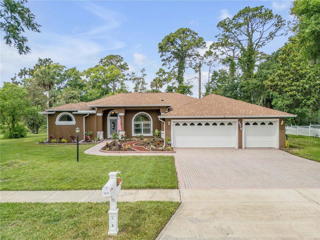 Photo of 5978 Shady Creek Lane, Port Orange, FL 32128 (MLS # NS1088453)