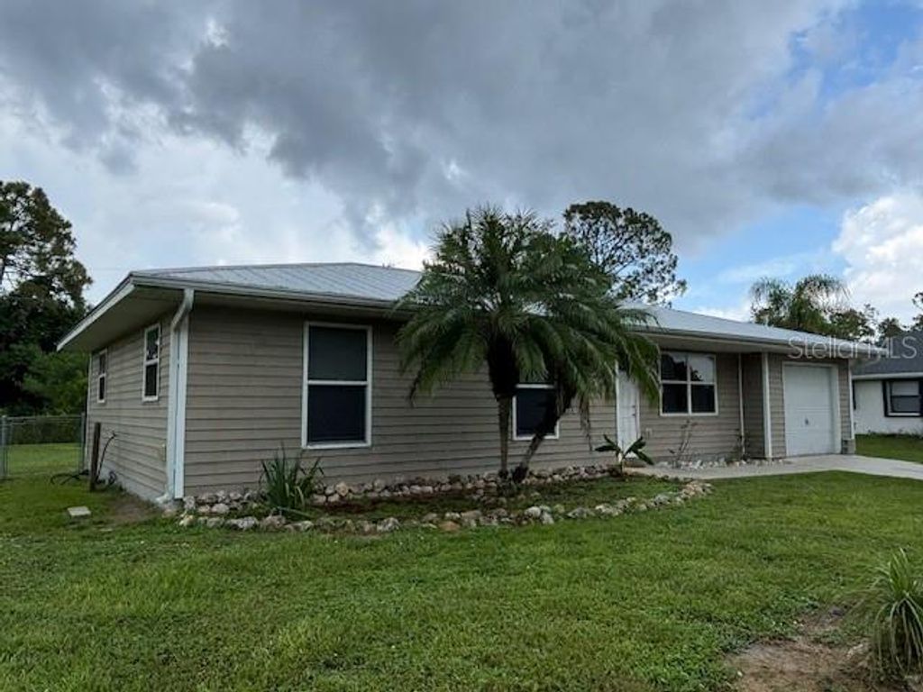 Photo of 5436 Stokes Street, Port Charlotte, FL 33981 (MLS # C7513760)