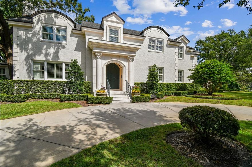 Welcome to this exceptional estate home in Parkland Estates, one of the most coveted neighborhoods in South Tampa situated on over ½ acre on a beautiful tree lined street. Step through the front entryway built of Italian imported stone into the beautiful and welcoming foyer with a lovely half circle staircase. Off to your left is an oversized dining room with fireplace and space to accommodate 12+ dinner guests.  Beyond the foyer is a cozy parlor with a small seating area and a baby grand piano overlooking the gorgeous black bottom pool and enormous privately walled in back yard.  Situated to the left of the foyer is the heart of the home with a huge kitchen with a double island, walk-in pantry, 72-inch Viking gas range, bar area and eat in kitchen all overlooking the expansive family room with vaulted beamed ceiling.  There are multiple glass doors in the family room that open to the pool area and lanai.  This one-of-a-kind yard is surrounded by a 6 ½ foot concrete block wall and a 20-foot hedge giving you ultimate security and privacy.  On the other end of the home is a guest suite which easily fits a king-sized bed, a home gym, the downstairs laundry and mudroom, an in-home steam room with Bose speakers as well as the enormous owner’s suite.  The owner’s suite overlooks the pool through French doors, has his and hers closets, and a spa like bathroom with a walk-in shower, soaking tub, double sink vanities, and a faux fireplace.  Take one of the two staircases up to the 2nd story which features an enormous bonus room plus 3 spacious bedroom suites and a very convenient climate-controlled storage room.  This estate home is perfectly maintained with a brand-new roof, all new AC’s, an electric wrought iron gate, upstairs and downstairs laundry rooms, built-in outdoor seating, a basketball court, outdoor kitchen+++ the amenities and details are too numerous to list… this is a MUST SEE!