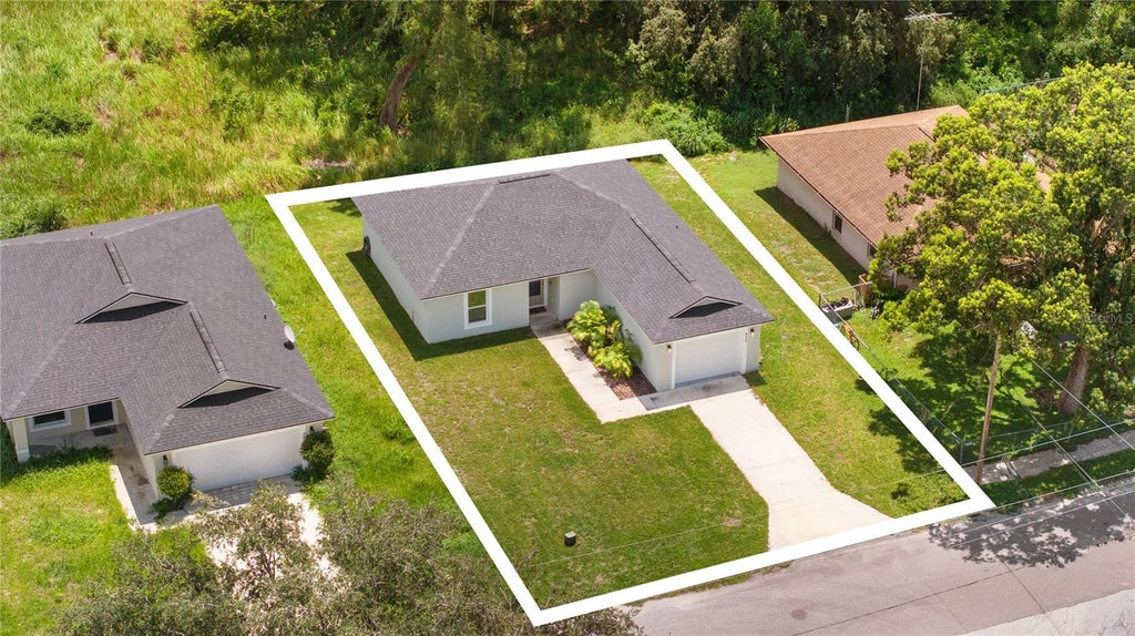 Photo of 495 S Oak Avenue, Fort Meade, FL 33841 (MLS # TB8537747)