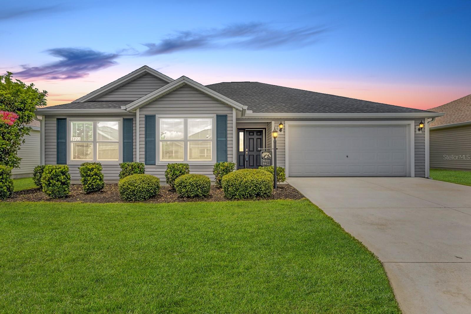 BOND PAID! This beautiful Designer Series Longleaf model offers style, comfort, and rare flexibility with a homesite that has room for a pool or birdcage—a highly sought-after feature! Step inside and enjoy volume ceilings that make the home feel open and airy, along with durable vinyl flooring in the main living and wet areas and plush carpet in the bedrooms. The kitchen is a showstopper with modern white cabinetry, stainless steel appliances including a gas range and side by side refrigerator, all perfectly suited for the home chef. The spacious primary bedroom features a tray ceiling and leads into a luxurious en suite bathroom with dual vanities and a seamless glass shower. At the rear of the home, a 21.3 x 11.8 glass-enclosed lanai offers the perfect retreat for relaxation after a day of fun and activity in the community. Additional features include knockdown ceilings for a clean, contemporary look. The remainder of The Villages 10-year structural warranty, 30-year architectural shingle warranty, and 10-year HVAC labor warranty are transferable to the new owner!