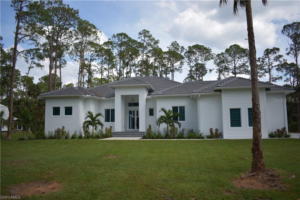 Fractional Ownership. Welcome to your dream home nestled on 2.73 acres of lush property! Less than five miles from Collier Blvd. This stunning house spans 2747 square feet under air, with a grand total of 4094 square feet. This home features a spacious 3-car garage. Step inside and discover the luxury within, with 4 bedrooms plus an office and 4 modern bathrooms, each equipped with stylish mirrors and integrated lighting, comfort meets sophistication. Walking closets with built-in cabinets ensure ample storage, complemented by the entire house's spray foam insulation for energy efficiency. The house features 2 AC units to keep you cool year-round, while impact-resistant windows and doors provide security and peace of mind. Marvel at the tile roof and sturdy stem wall construction, promising durability and longevity. The integrated reverse osmosis system ensures pristine water quality throughout, enhancing daily living. Relaxation awaits in the living room and master bedroom. The custom kitchen cabinets both beauty and functionality, perfect for culinary endeavors. Step outside to your private oasis—a sprawling pool and jacuzzi set amidst an expansive deck. The lanai features a summer kitchen equipped with everything you will need to keep your guests entertained.