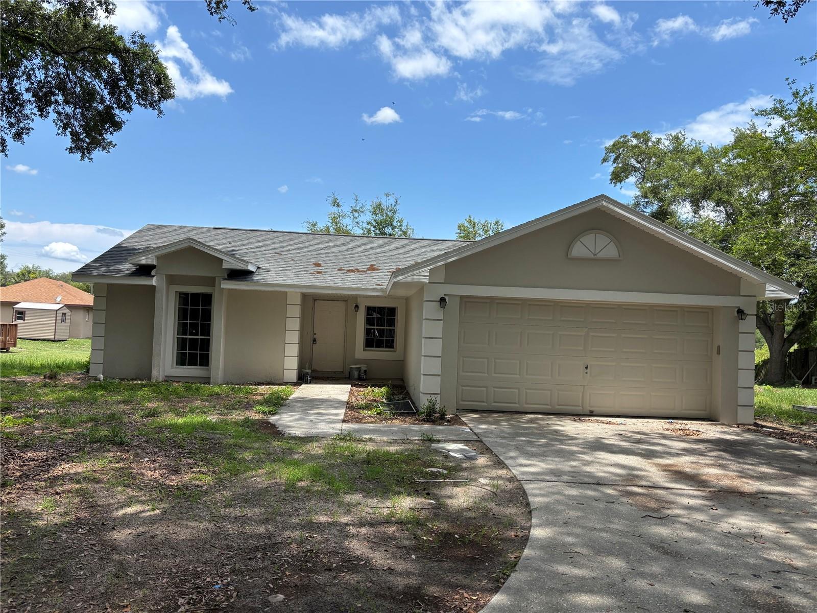 0% DOWN PAYMENT ELIGIBLE! NO HOA! GREAT INVESTMENT OPPORTUNITY! No leasing restrictions! Perfect for Airbnb or long-term rental. Calling all investors and first-time homebuyers! This 3-bedroom, 2-bath single-family home, built in 1993, is located in the heart of Minneola and offers incredible potential just minutes from top-rated schools. Sitting on a generous 0.37-acre lot, this property has great bones and several major updates already completed: New Roof (09/2022) Water Heater (01/2023) AC Serviced (05/2025) The home features a spacious attached 2 car garage, and just needs a bit of updating and TLC to truly shine. Enjoy a screened-in patio with a beautiful view of the lush garden and mature trees in the backyard, offering a peaceful outdoor space perfect for relaxing or entertaining. Seller financing and private financing available. BUY THIS HOME WITH NO DOWN PAYMENT! $0 down payment financing options available. Don’t wait, this one won’t last long!