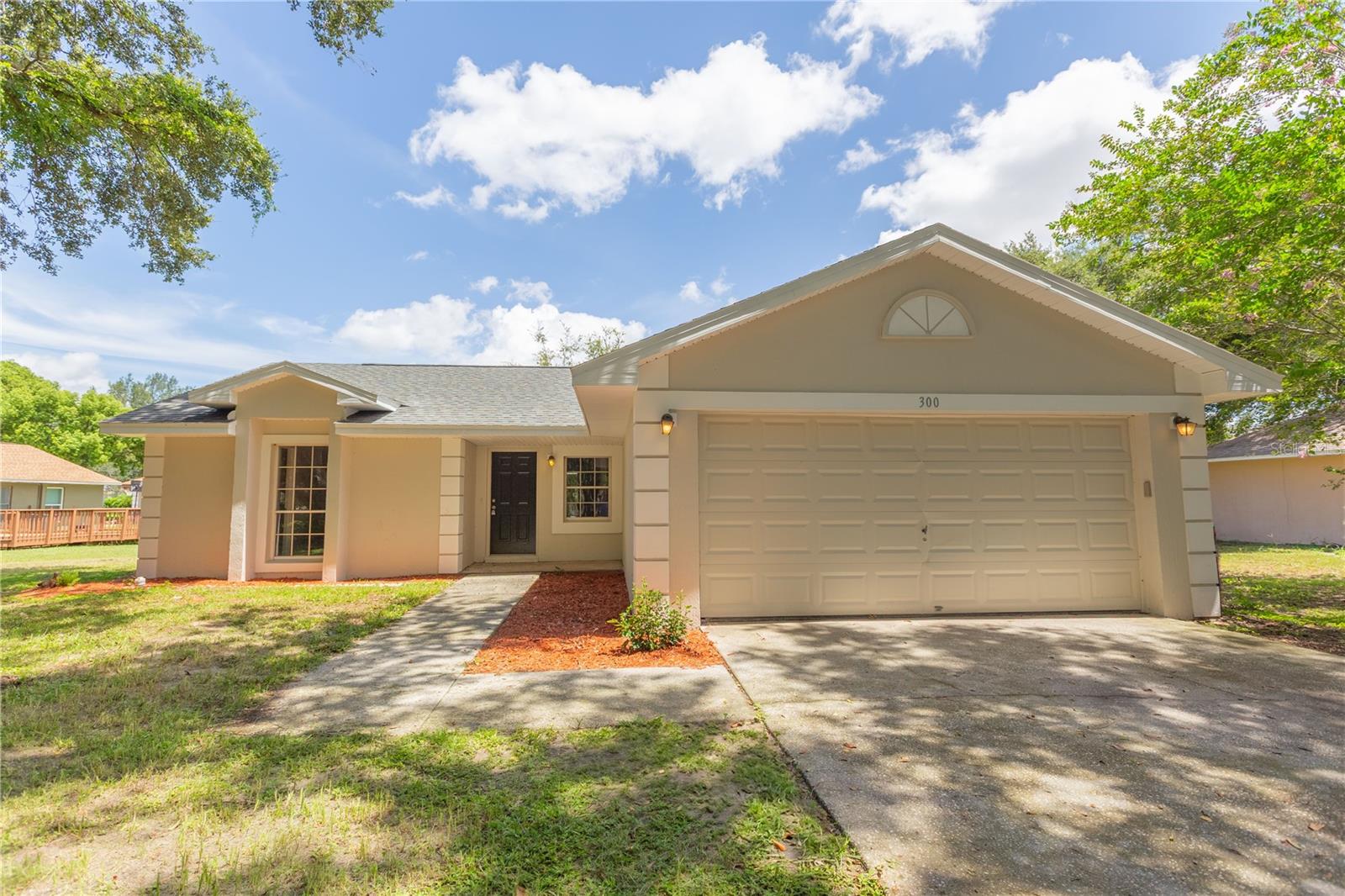 Under contract-accepting backup offers. 0% DOWN PAYMENT ELIGIBLE! NO HOA! GREAT INVESTMENT OPPORTUNITY! No leasing restrictions! Perfect for Airbnb or long-term rental. Calling all investors and first-time homebuyers! This 3-bedroom, 2-bath single-family home, built in 1993, is located in the heart of Minneola and offers incredible potential just minutes from top-rated schools. Sitting on a generous 0.37-acre lot, this property has great bones and several major updates already completed: New Roof (09/2022) Water Heater (01/2023) AC Serviced (05/2025) The home features a spacious attached 2 car garage, and just needs a bit of updating and TLC to truly shine. Enjoy a screened-in patio with a beautiful view of the lush garden and mature trees in the backyard, offering a peaceful outdoor space perfect for relaxing or entertaining. Seller financing and private financing available. BUY THIS HOME WITH NO DOWN PAYMENT! $0 down payment financing options available. Don’t wait, this one won’t last long!